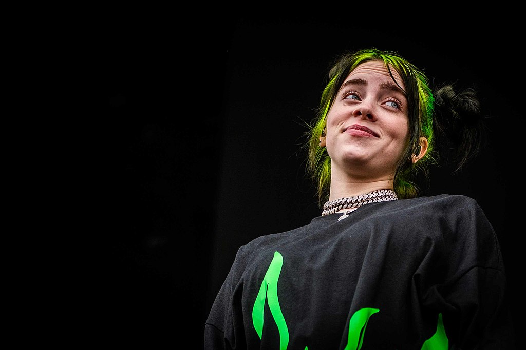 Billie eilish's hair is green, but so is her tour