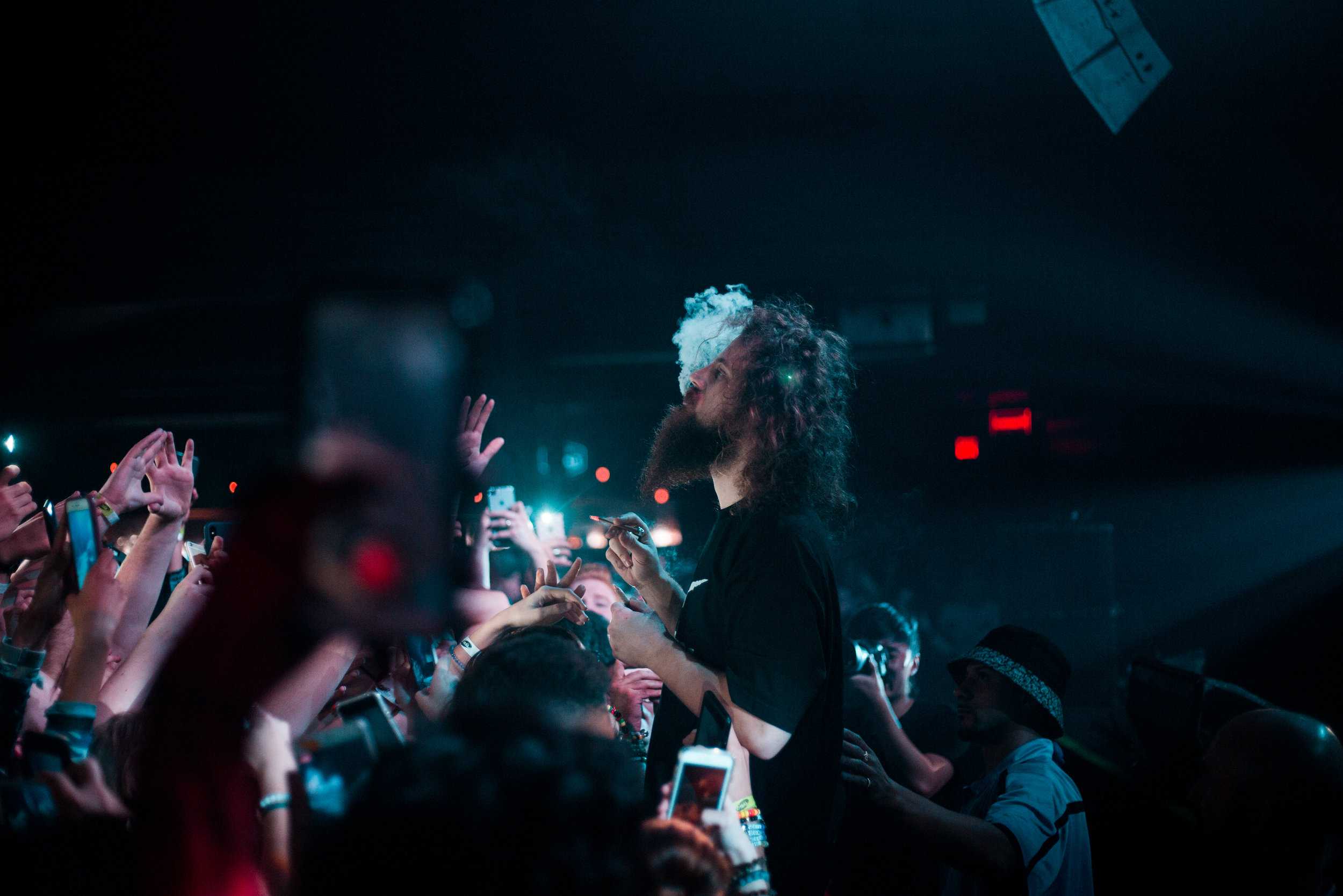   Kevin smokes over the crowd as a mix begins to play.  