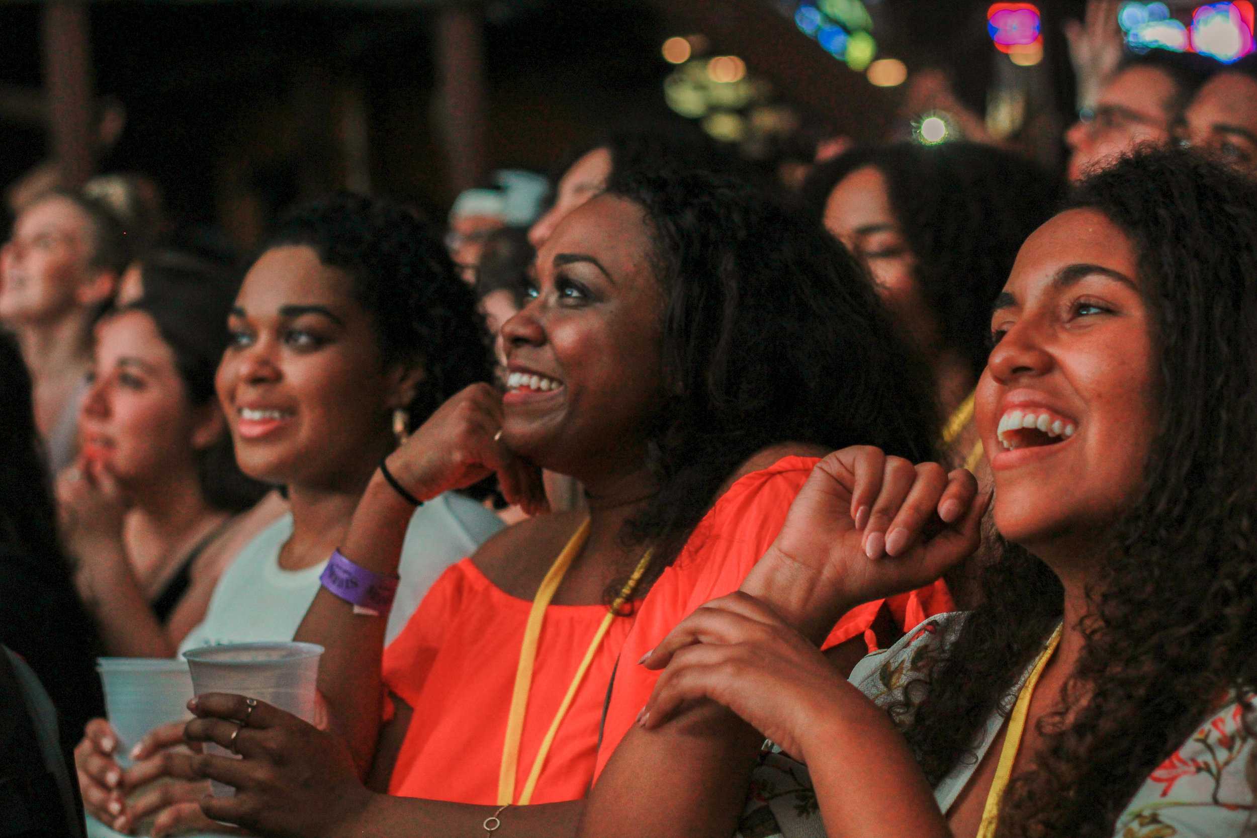   Fans in the front row smile as Miguel came out on stage for the first time.  