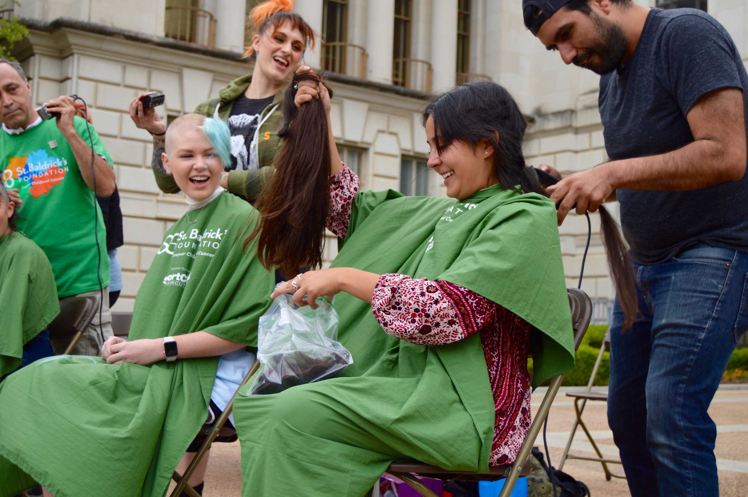   Bonilla raises up her locks of hair.   