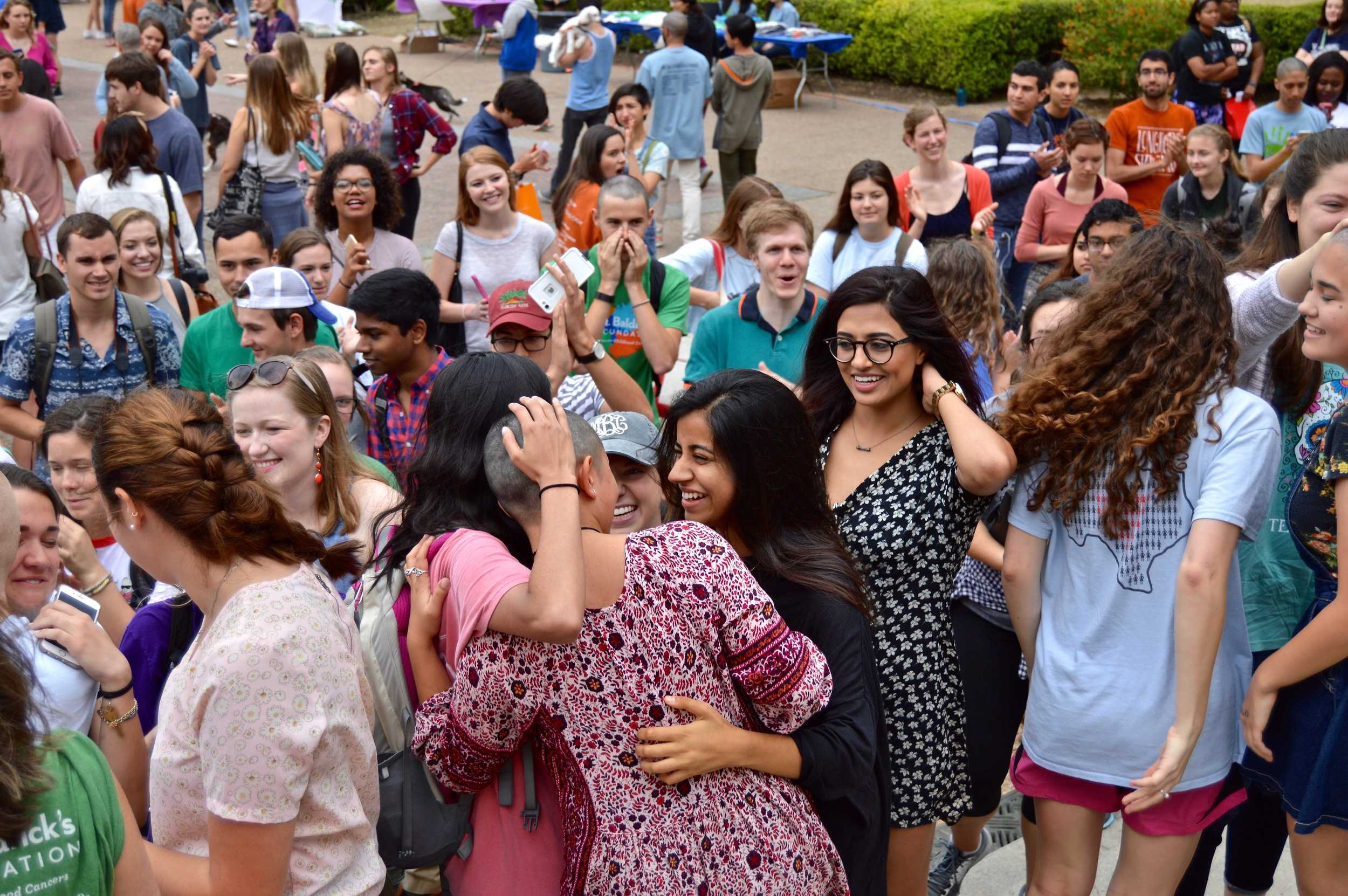   Once Bonilla braved the shave and her haircut was done she walk down the UT steps and was hugged by friends and family.   