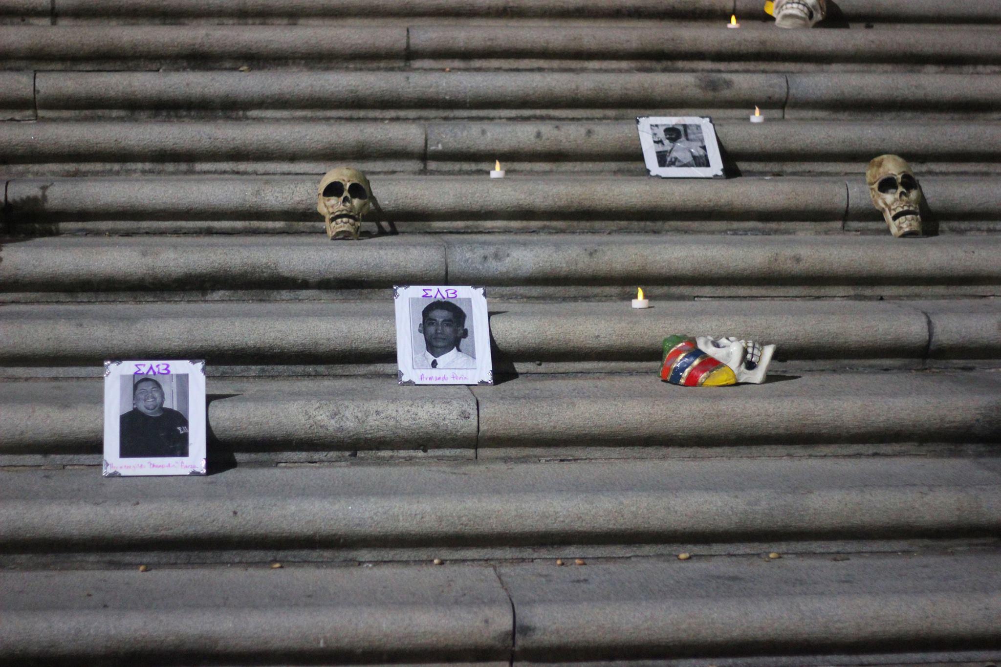   Pictures of deceased loved ones were placed on the steps of the UT Tower by individuals from the crowd to show respect.  