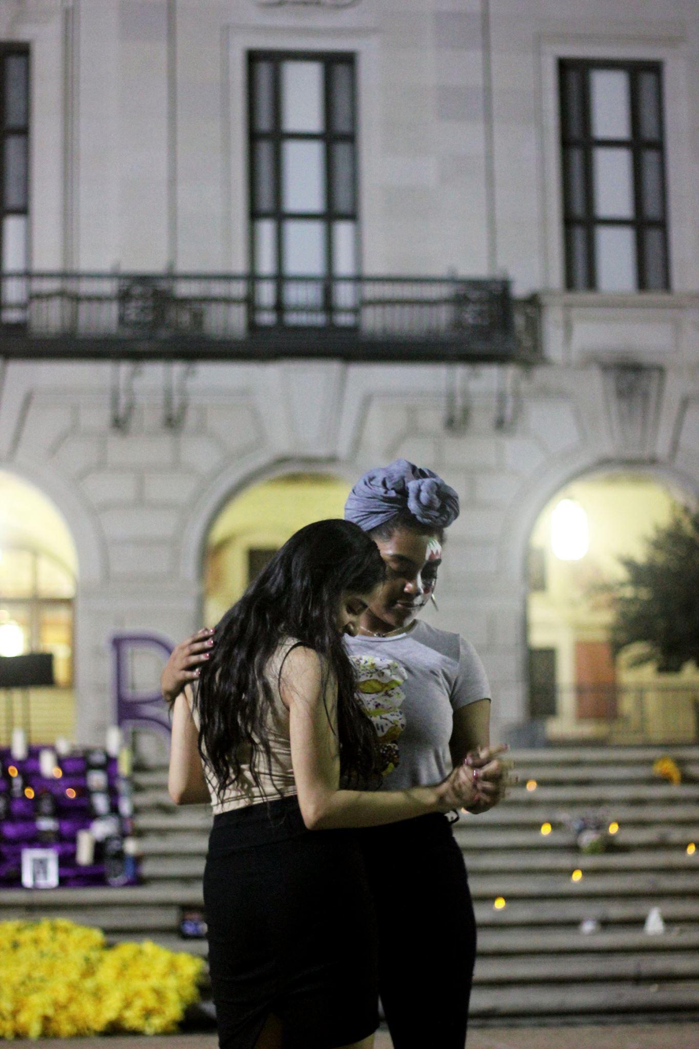   Two individuals dance together to one of the musical performances.   