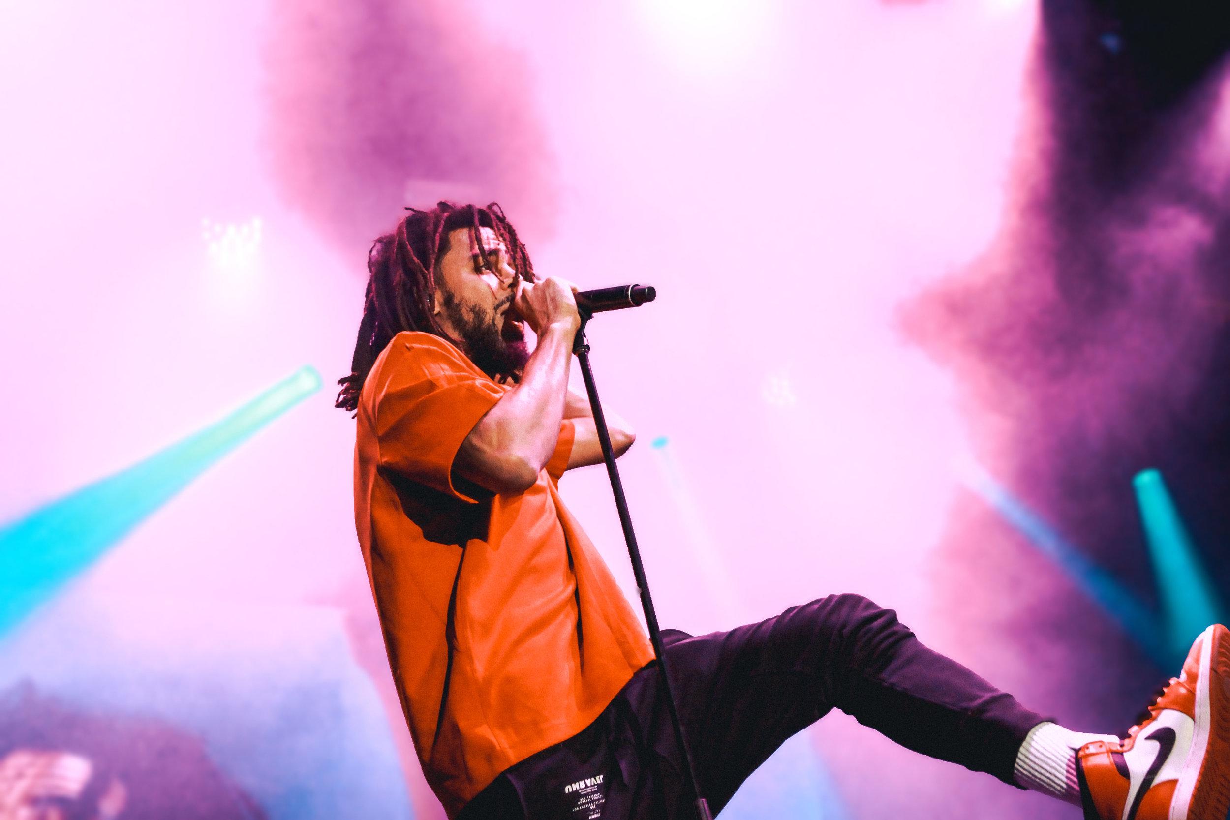   J. Cole rapped and danced across the stage throughout his set.  