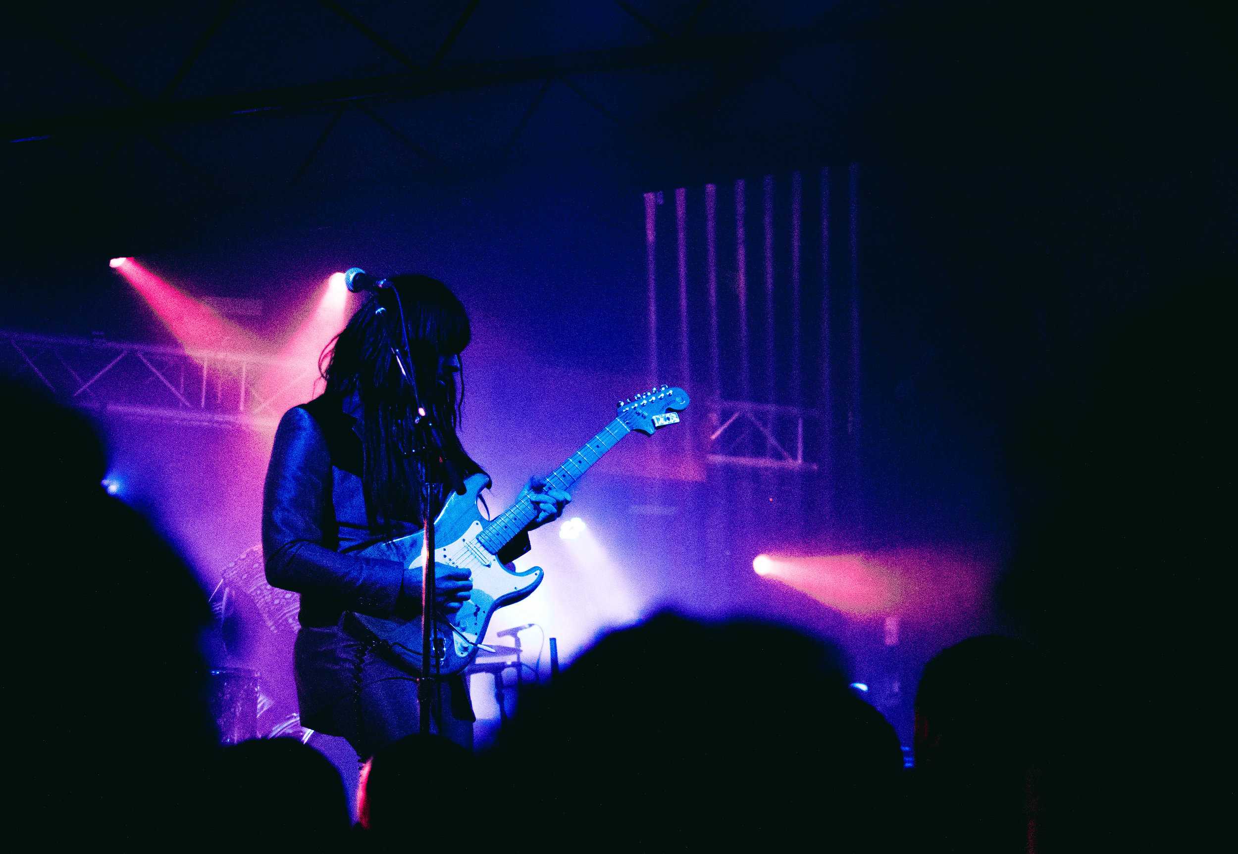  Speer wows the crowd while he shreds on guitar during his solo. 