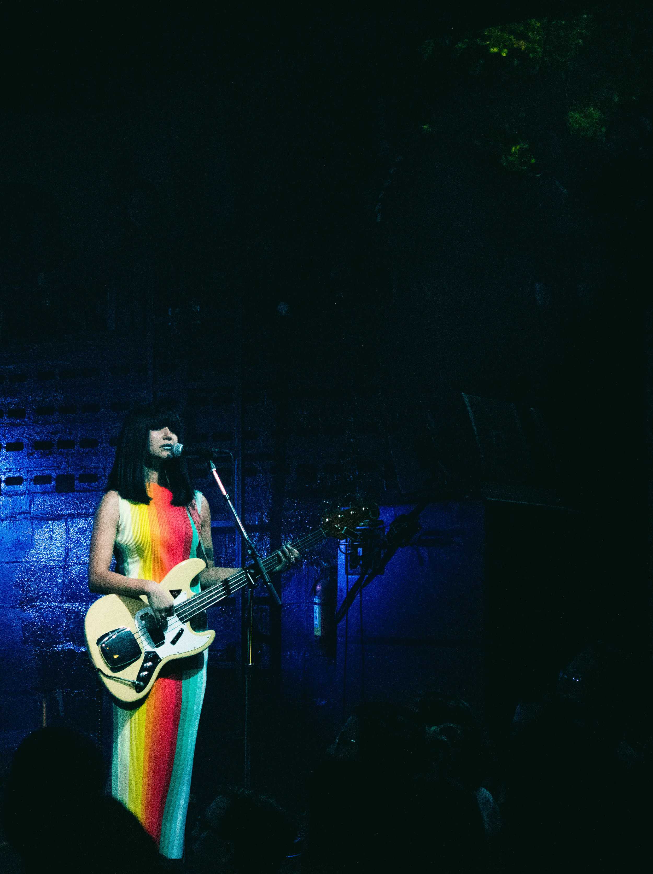  Lee donned a long, rainbow dress, hypnotizing the concert-goers with sparkling blue lipstick and matching sparkling silver boots. 