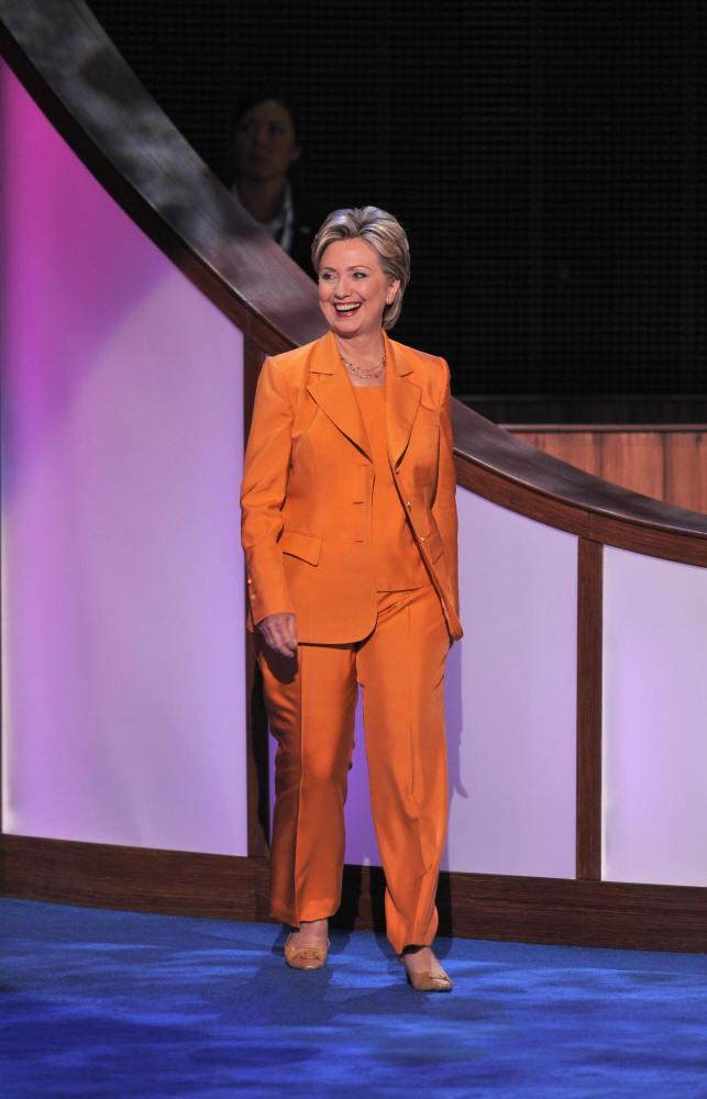   3. 2008- Owning the Orange       Strolling into the Democratic National Convention in Denver, Clinton reps some electric orange.     