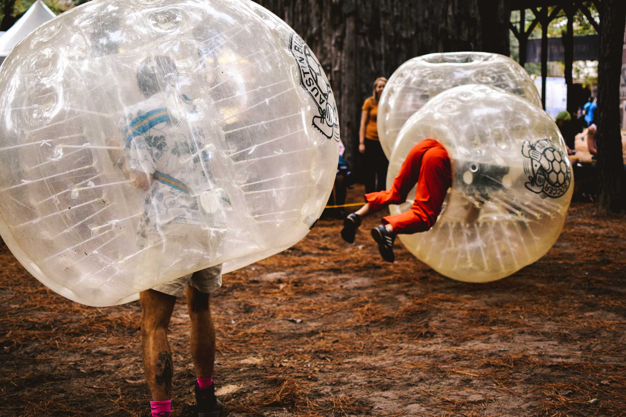   Attendees play bubble jousting while waiting for the next performance.  