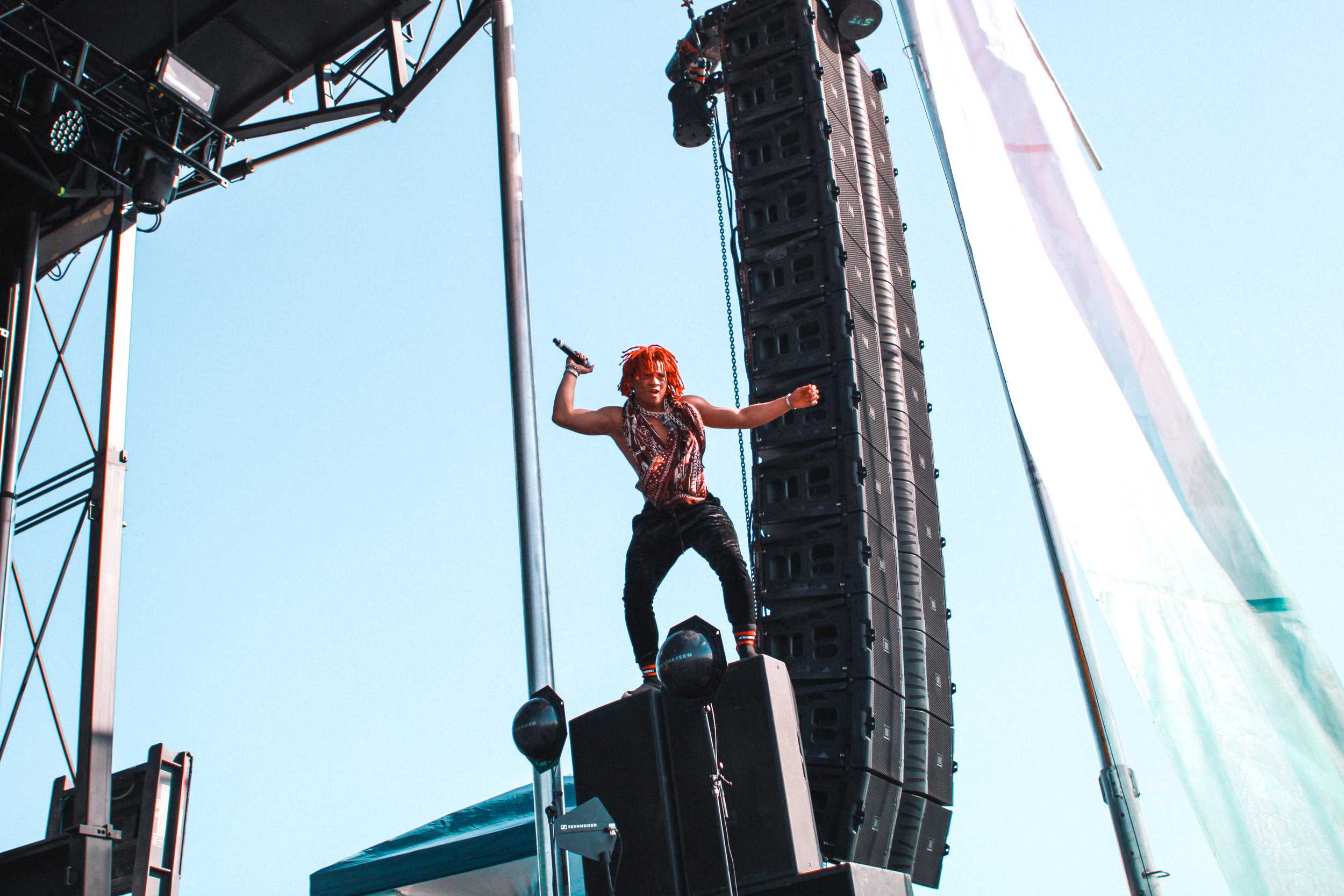   Trippie Redd climbs up onto the speakers while performing.  