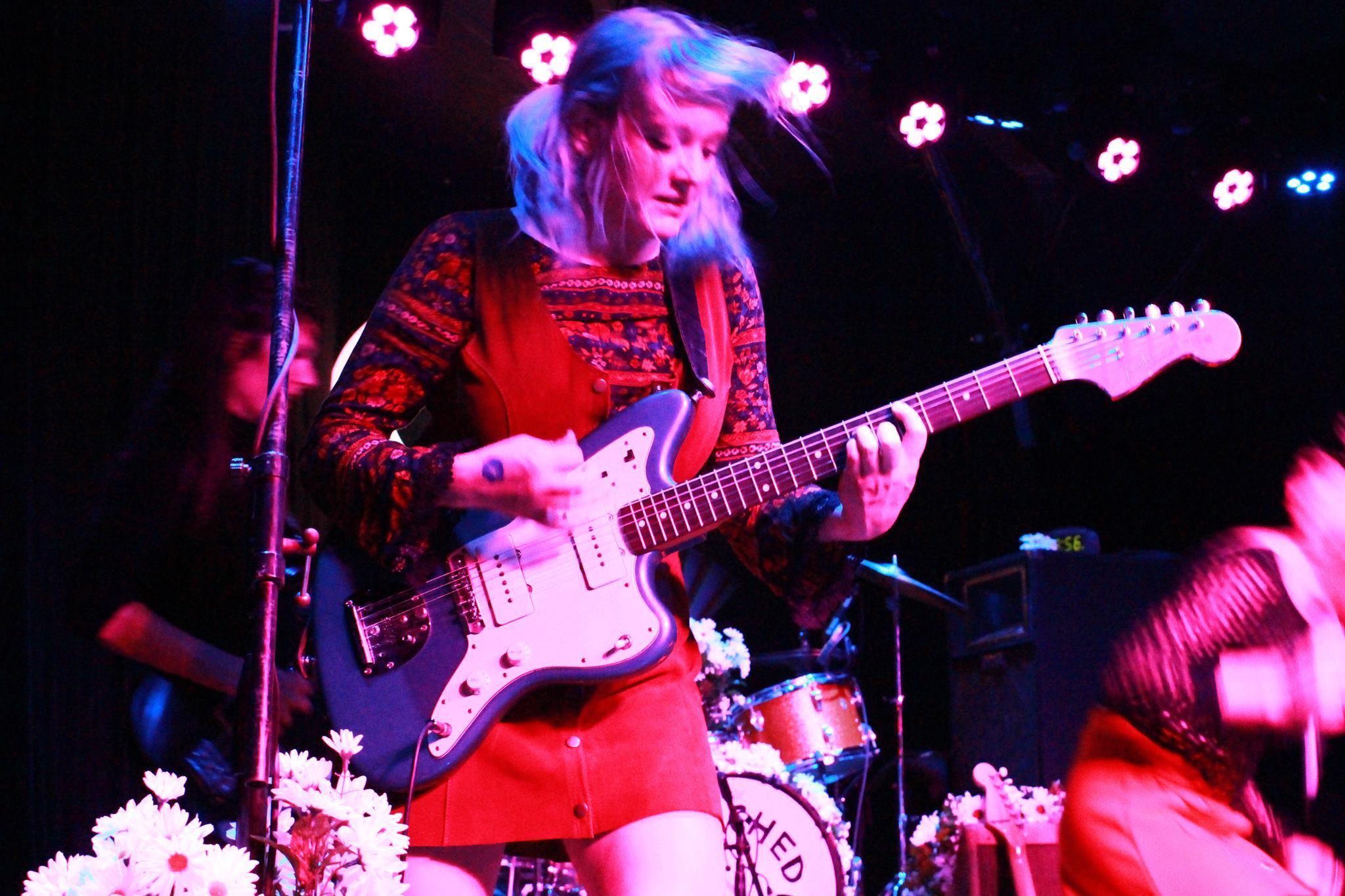   Jessica Clavin of Bleached borrows a bass from opening punk band, No Parents.  