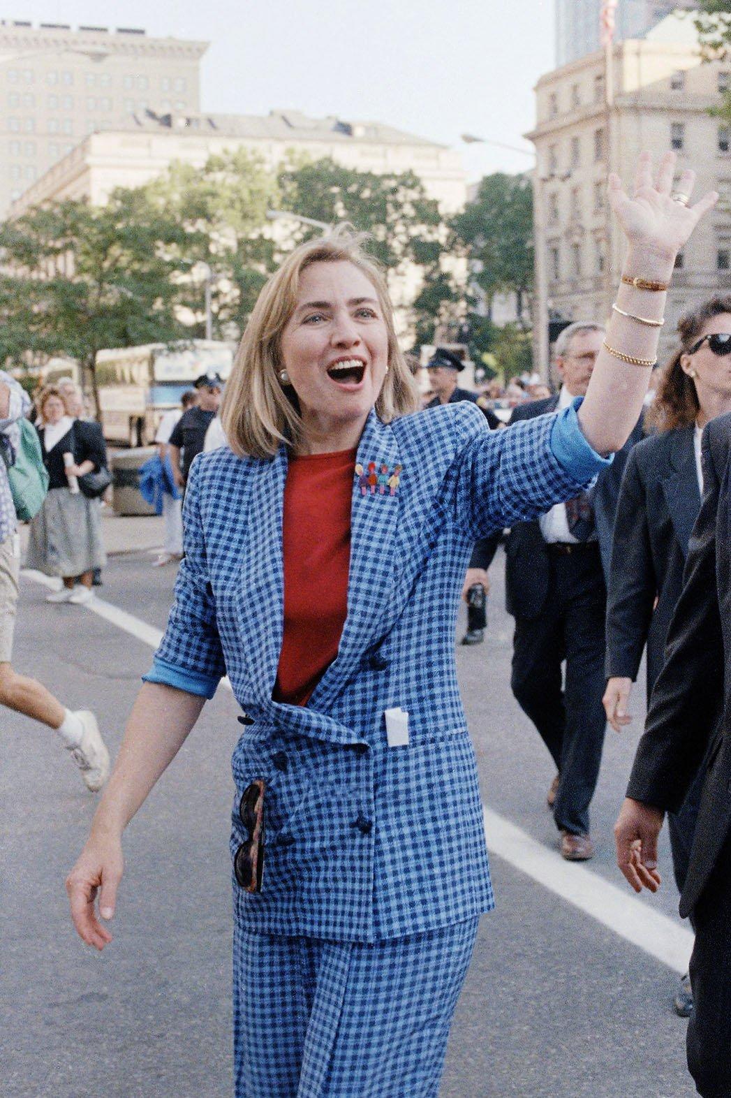   10. 1992- The Picnic Pantsuit     Clinton pops over to Ohio on a campaign trip for Bill. Note the pin of children on her lapel!     