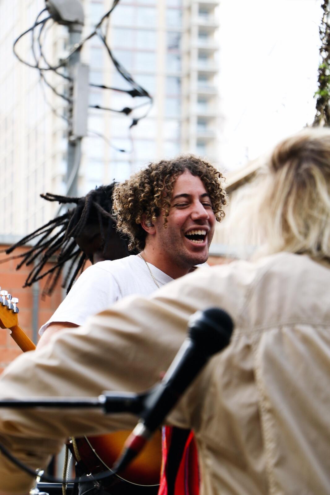   Danny Miller of Lewis Del Mar shares a laugh with the band in between songs.     