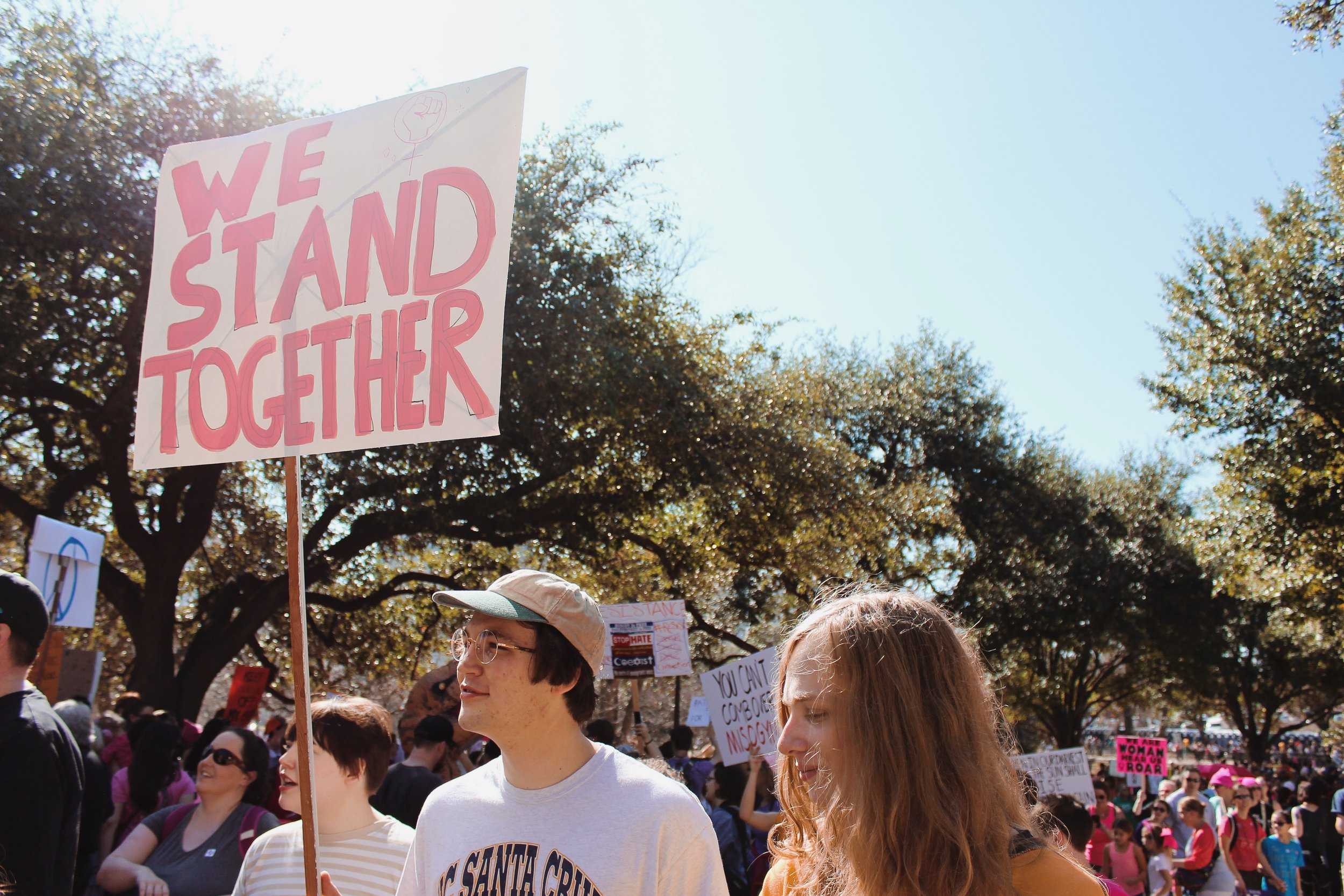   Men marched alongside women to stand for equality and unity.     