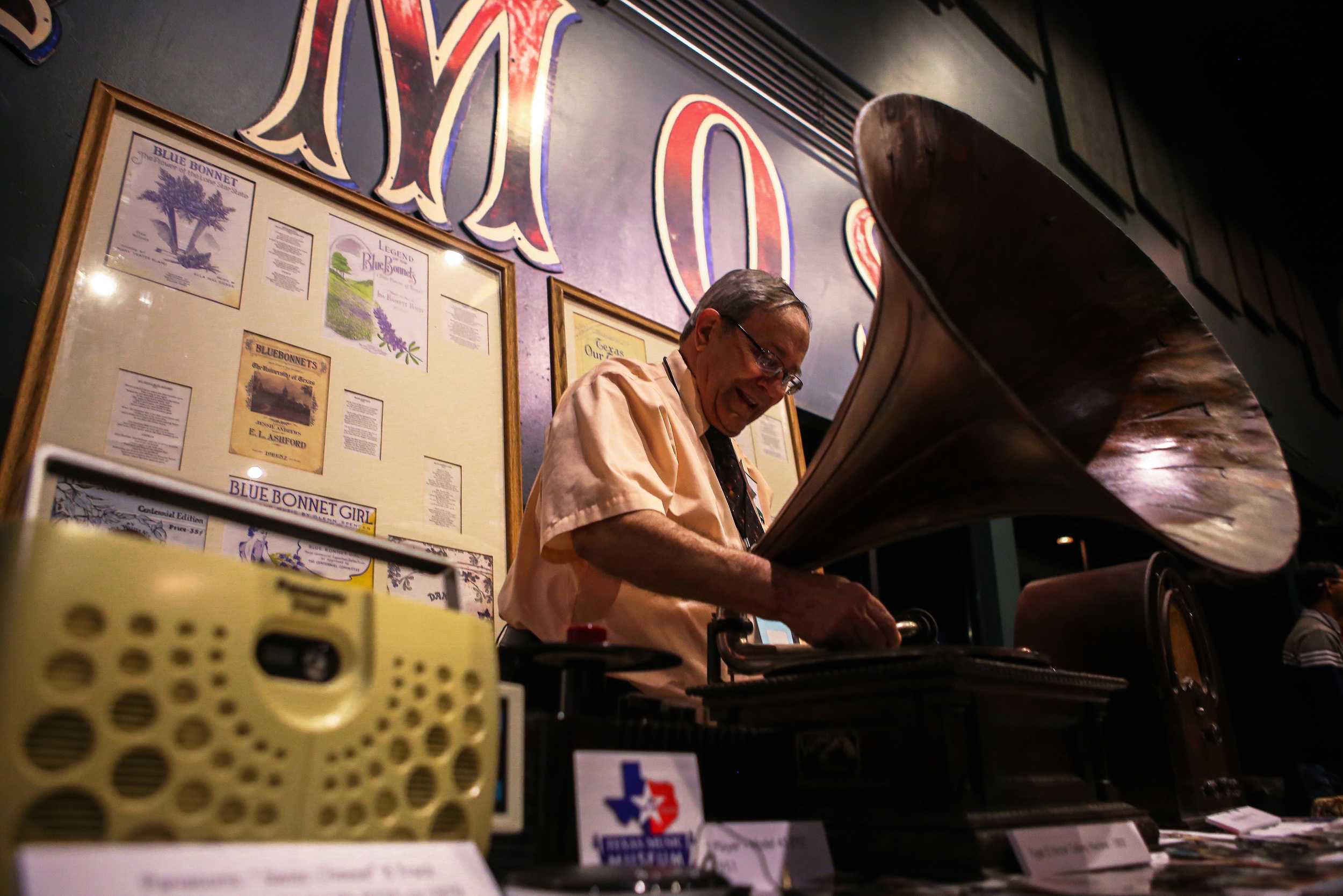   The Texas Music Museum display various pieces of their collections from left to right: a Panasonic “Swiss Cheese” 8 Track Stereo Player,&nbsp;a Type D Victor Talking Machine and an antique radio.  