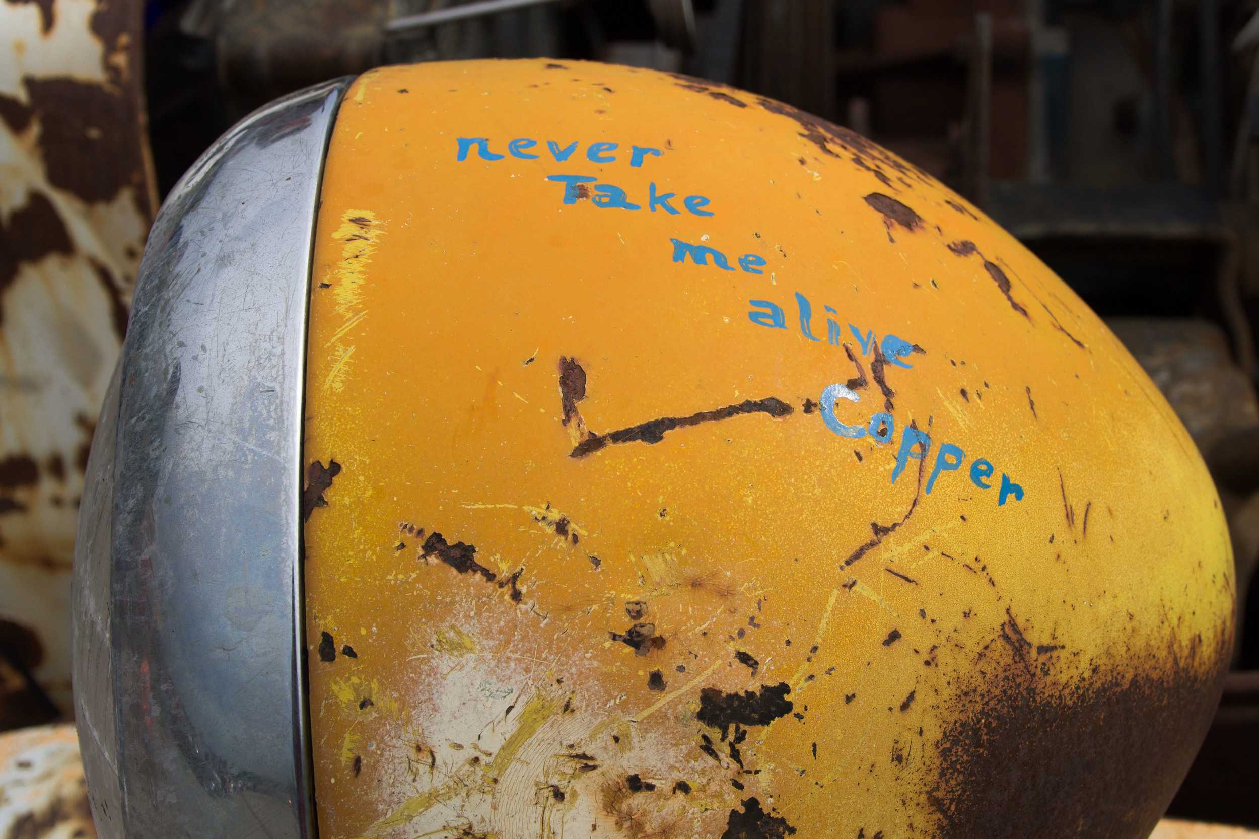  Jacques Tixier wanted to establish his car as a rebel vehicle. The words “never take me alive Copper” painted on the car’s left headlight certainly gets the message across. 