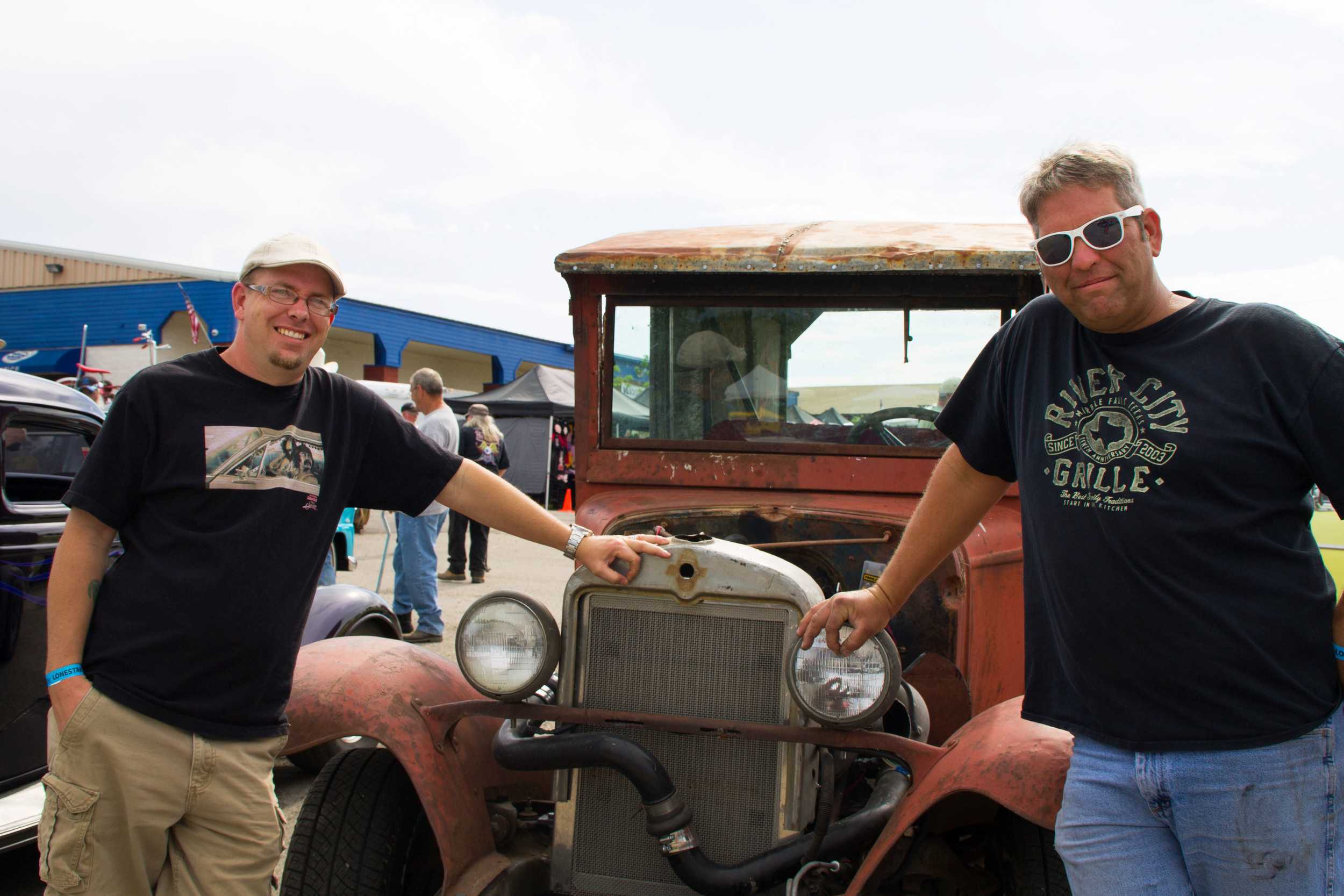  Billy Kingston and Chris Carnahan smile and stand next to a car they built for Kingston’s mom, Kelly. Although the car took six months to build, there wasn’t a lot of planning involved, says Kingston. “It was a drunken moment, and it just went from 