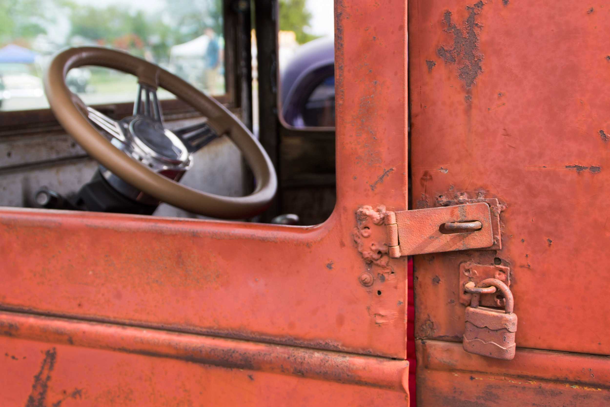  Peeling red paint on rusting metal, this car, built by Kingston and Carnahan features rustic accents. 