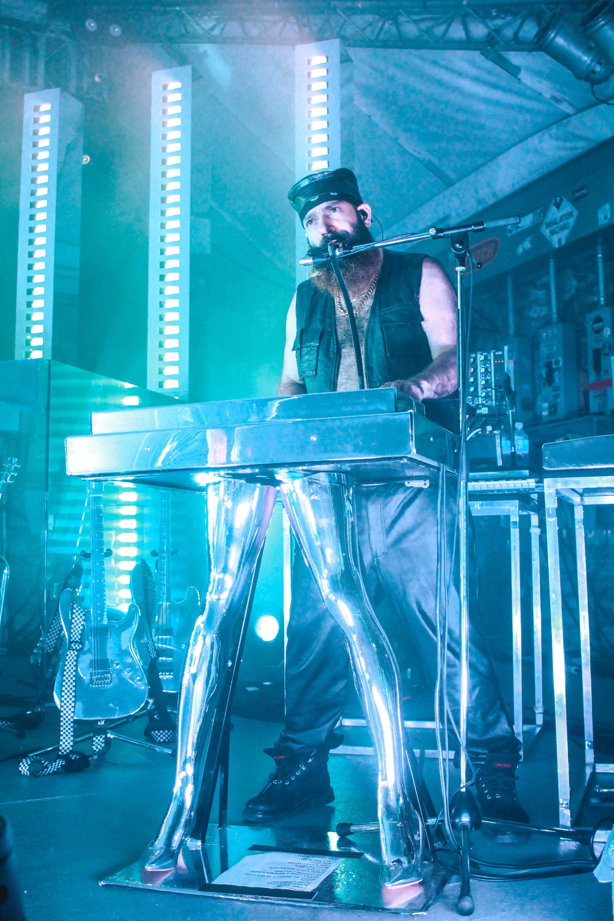   P-Thugg stands with Chromeo’s legendary keyboards featuring silver legs.  