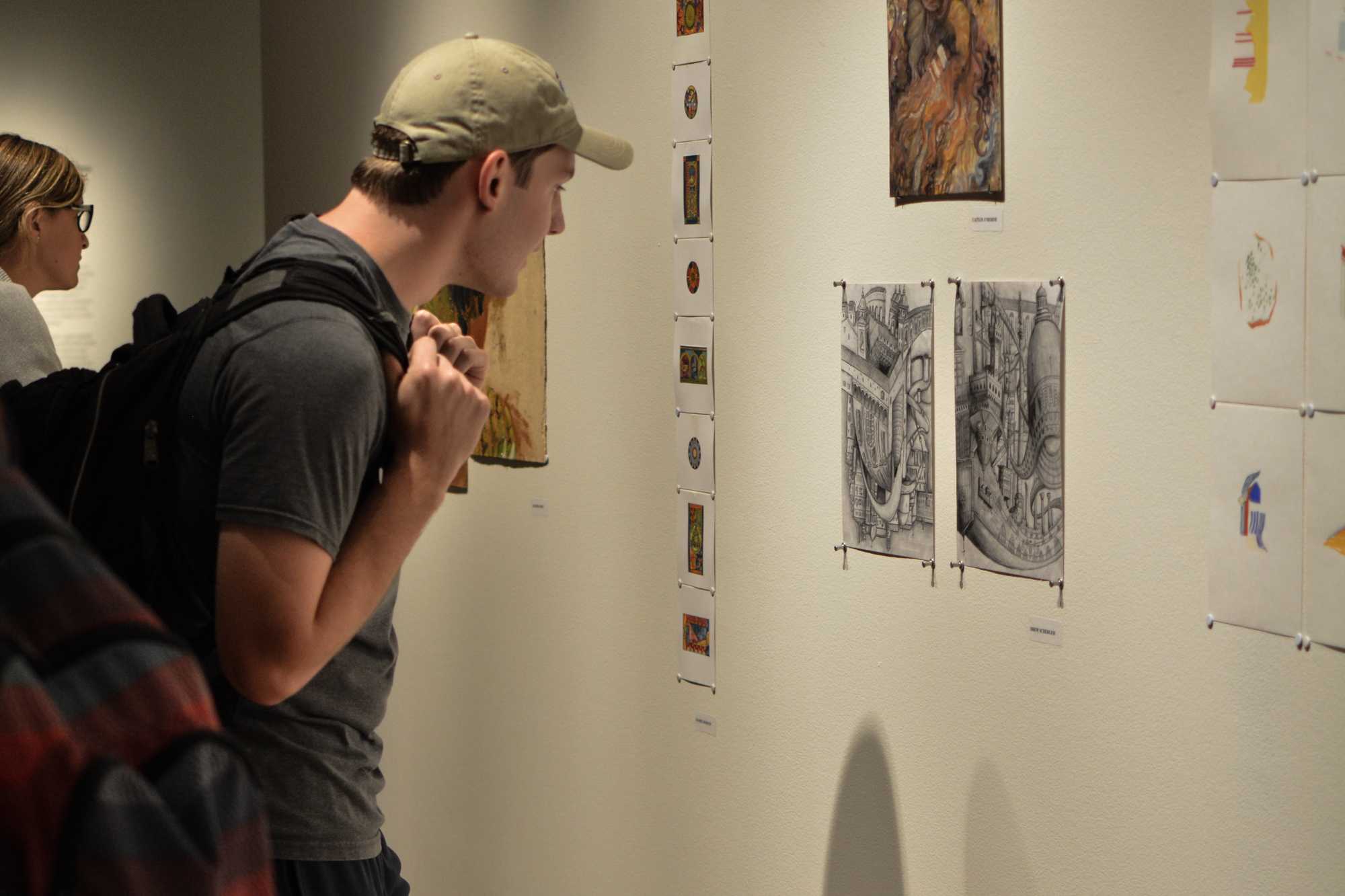   Visitors attended the Study Abroad Art Show in the Visual Art Center.  