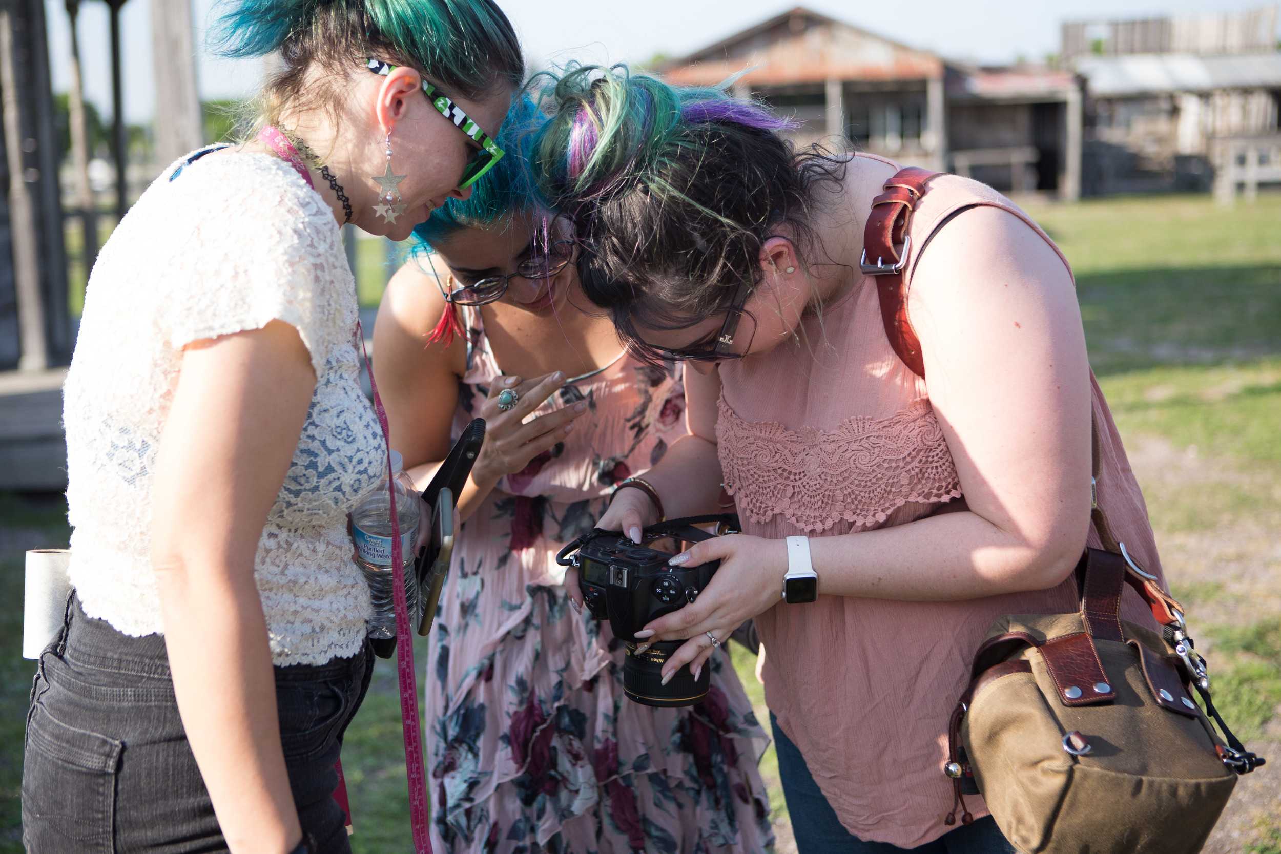   Nordström and her assistants preview some of the shots she has taken.   