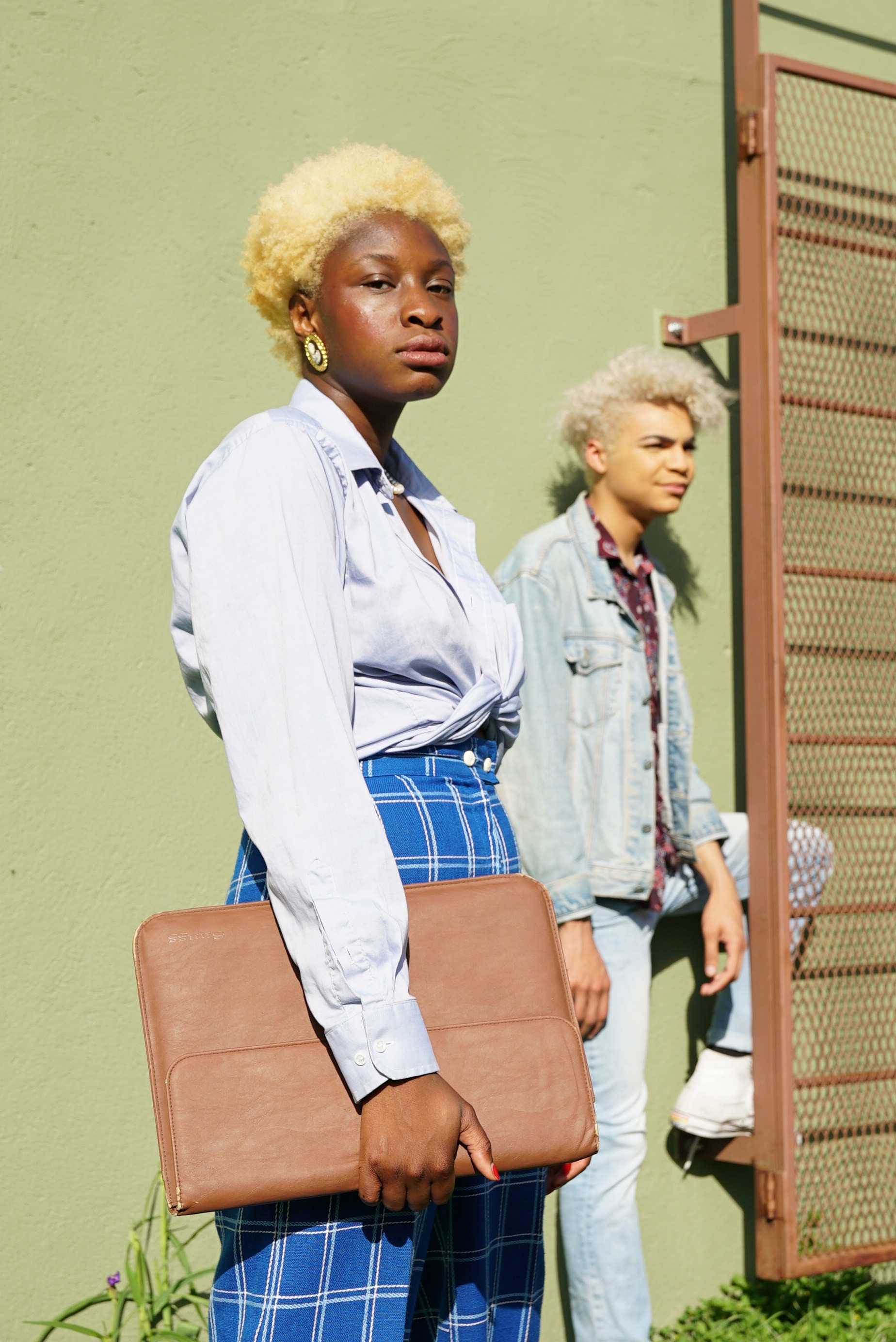   Amudo wears blue and Lewis wears denim on denim to show their personal styles choices.  