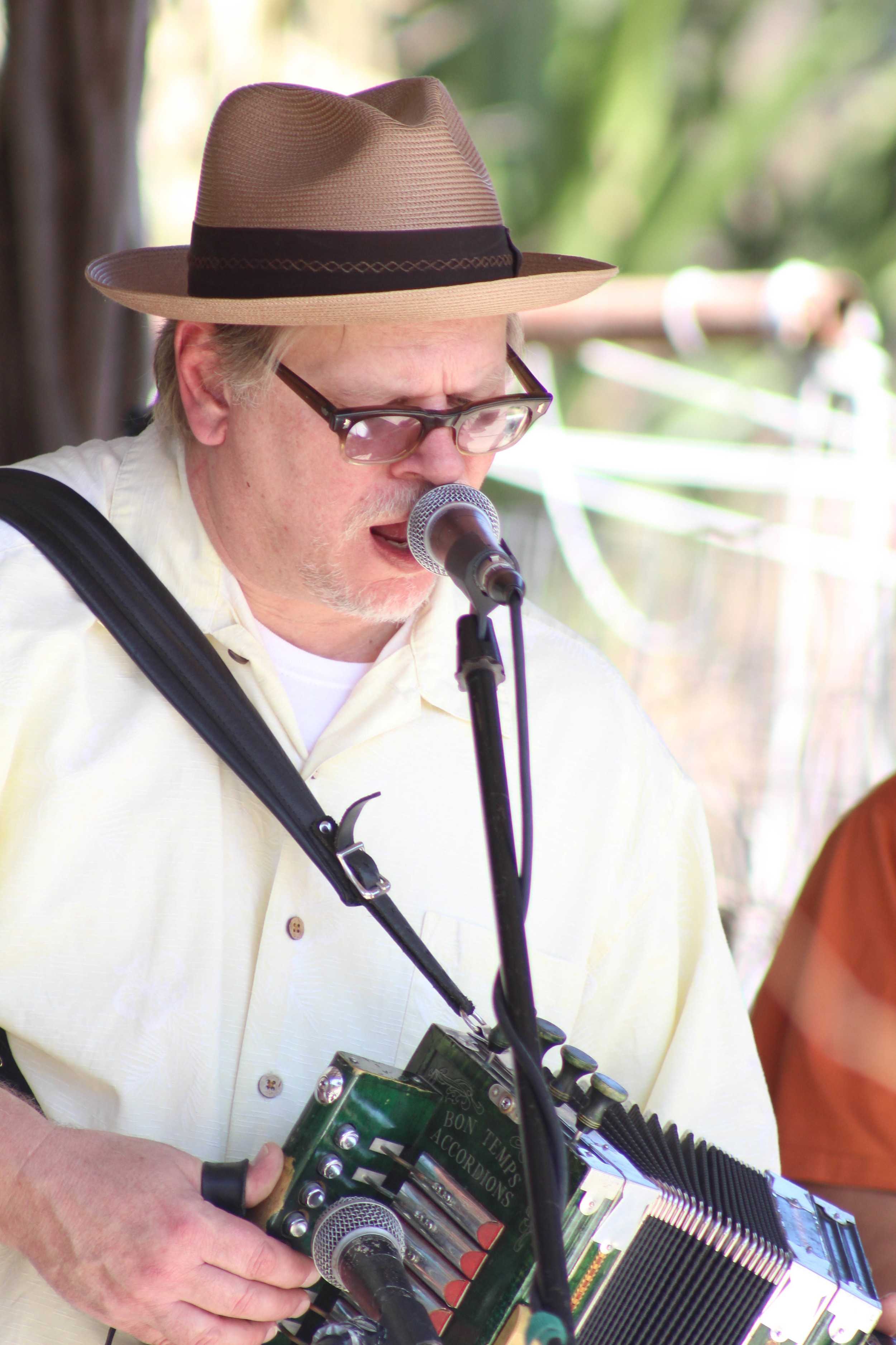   Lead singer of the Gulf Coast Playboys, Bradley Jaye Williams, sings and plays his accordion.  