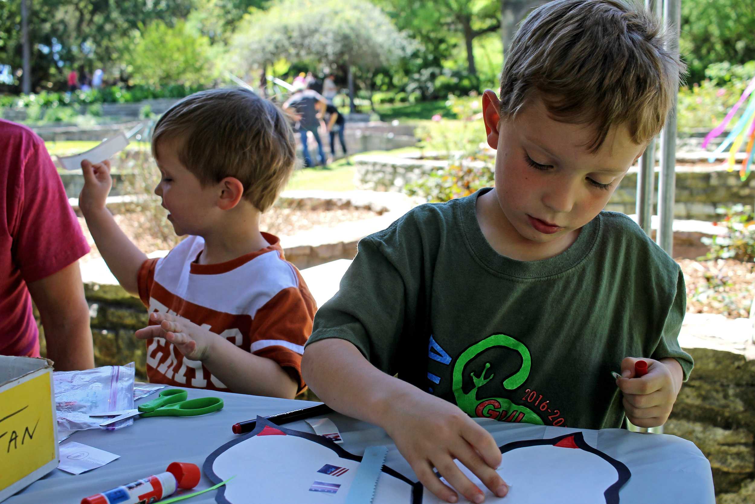   Stanley, age 3 (pictured left) and Walter, age 5 (pictured right), enjoying the festivities of the day.  