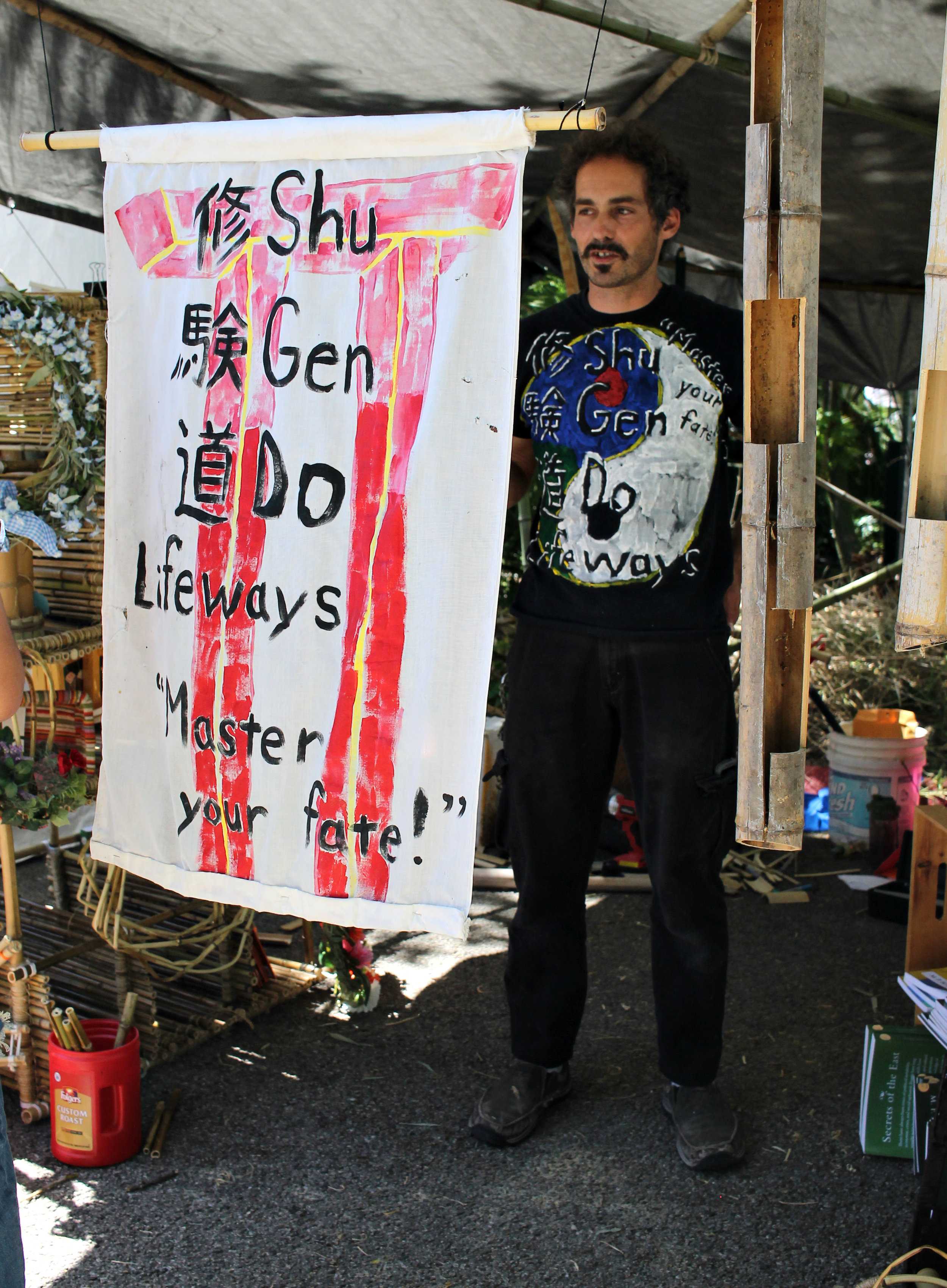   Vendor Michael Schaefer with his shop Shu Gen Do where he sells an arrangement of bamboo pieces.  