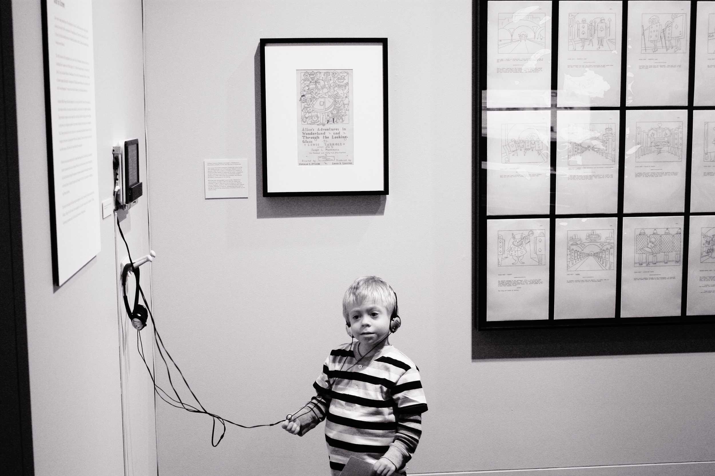  A young boy listens to an audio tape of the book “Alice’s Adventures in Wonderland." 