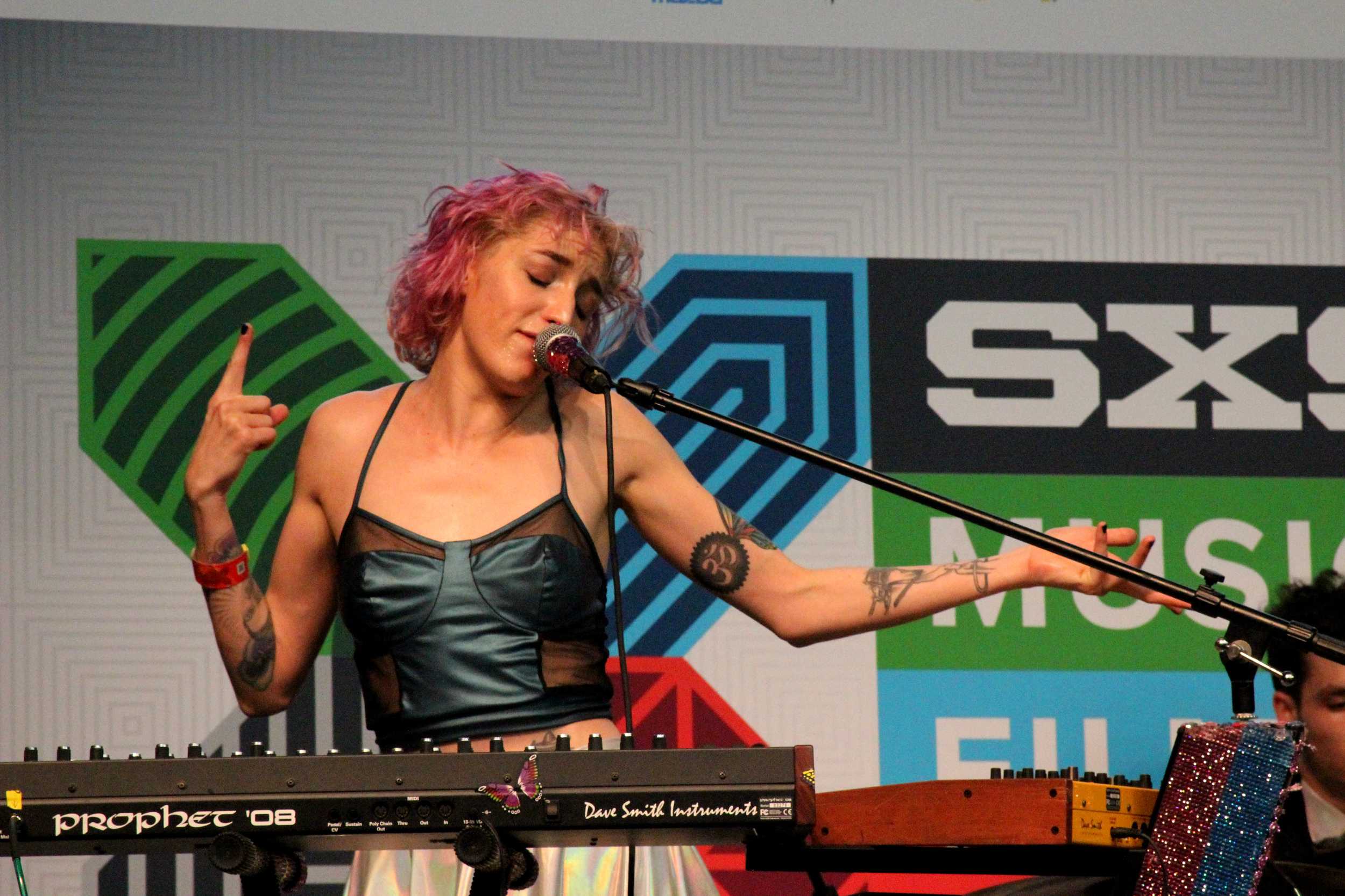  Laura Patino of Austin electronica act Holiday Mountain performs at the Flatstock Stage in the Austin Convention Center. Photo by Tess Cagle.&nbsp; 