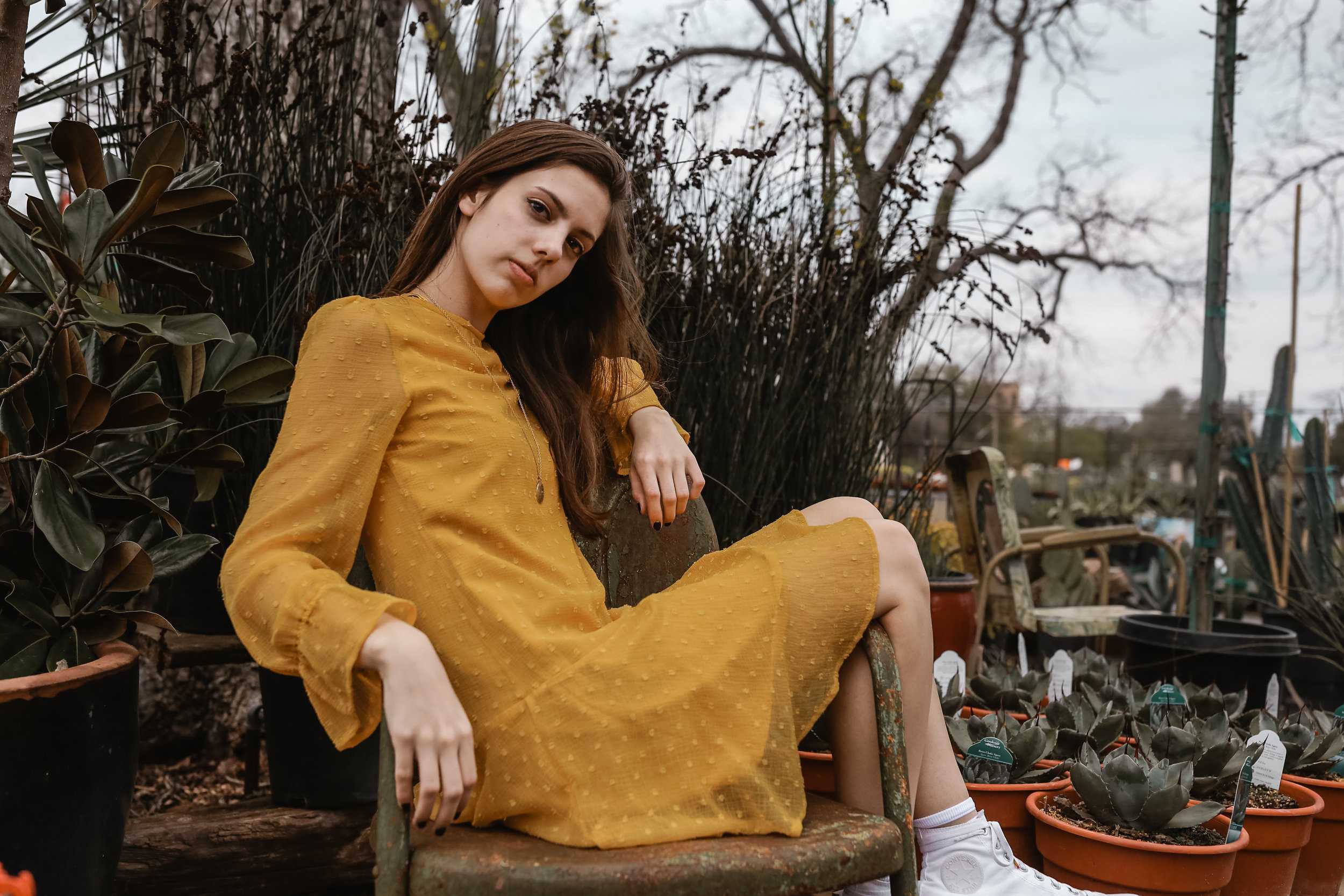   Claire Levinson keeps it casual with a textured long sleeve dress and a necklace.  