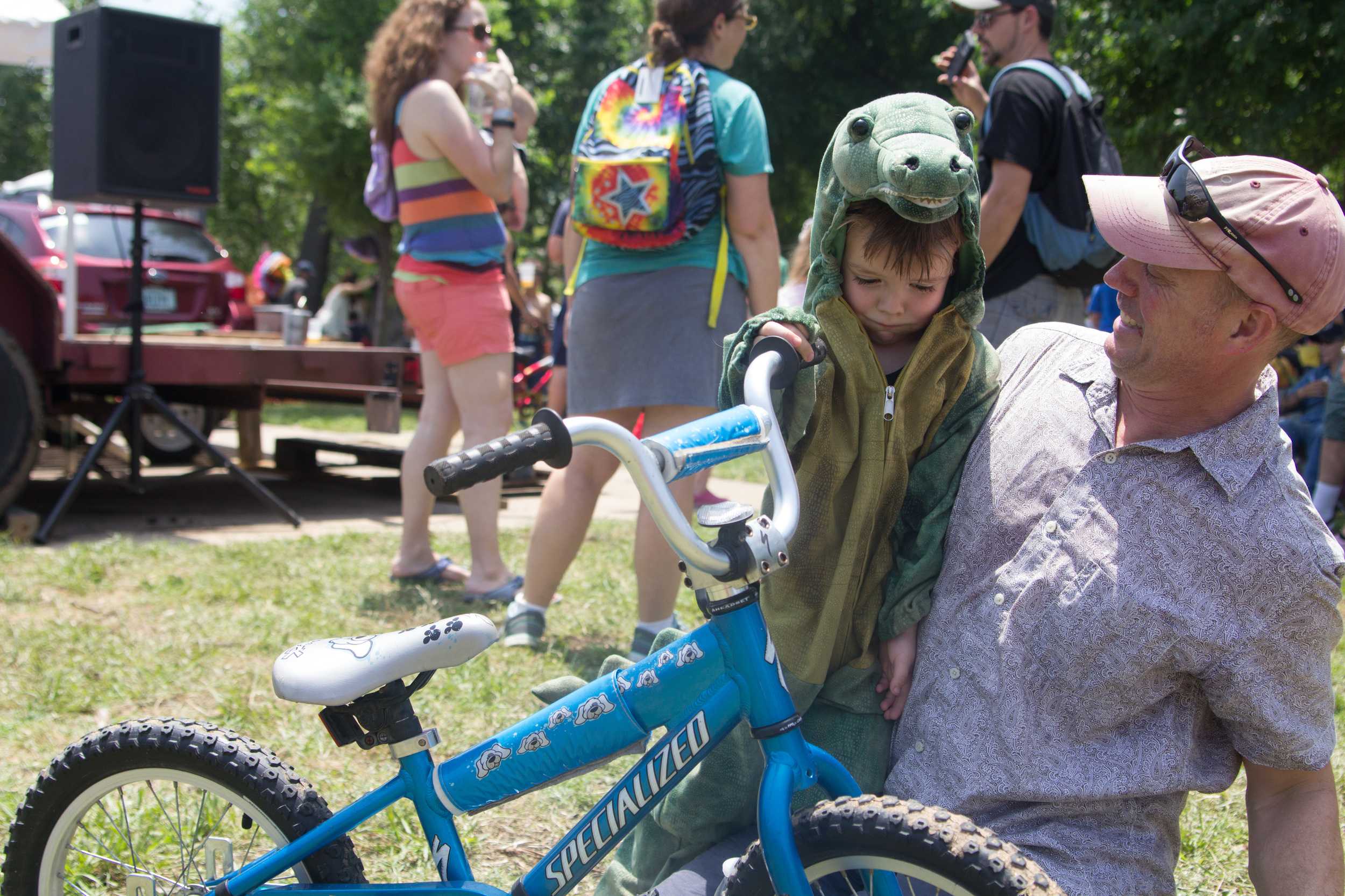   Wiley, the children’s costume contest winner, poses with the bike he won.     