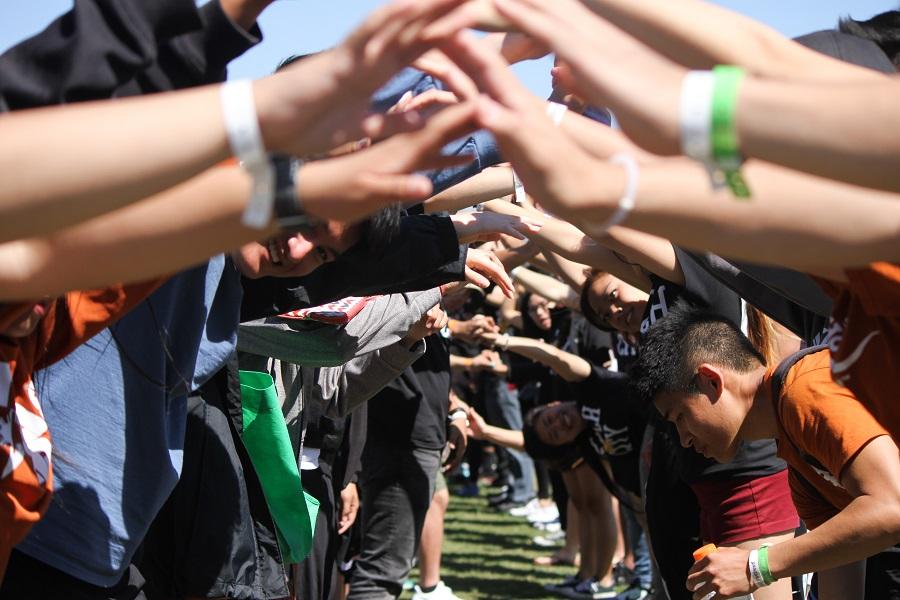  UH players huddles up during one of their many soccer matches on the Saturday of the games 