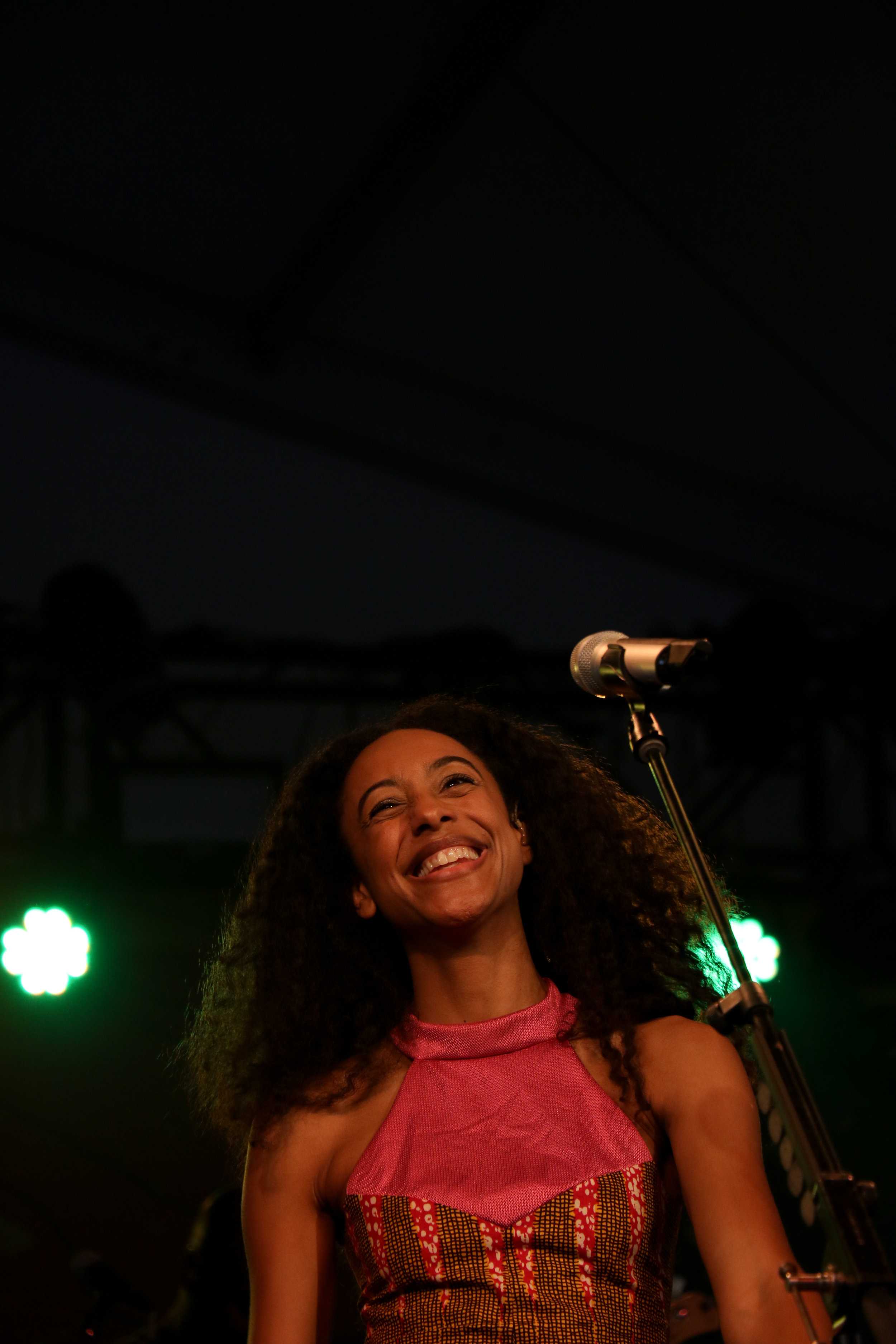   Corinne Bailey Rae smiles as the crowd applauds at the end of her number.  