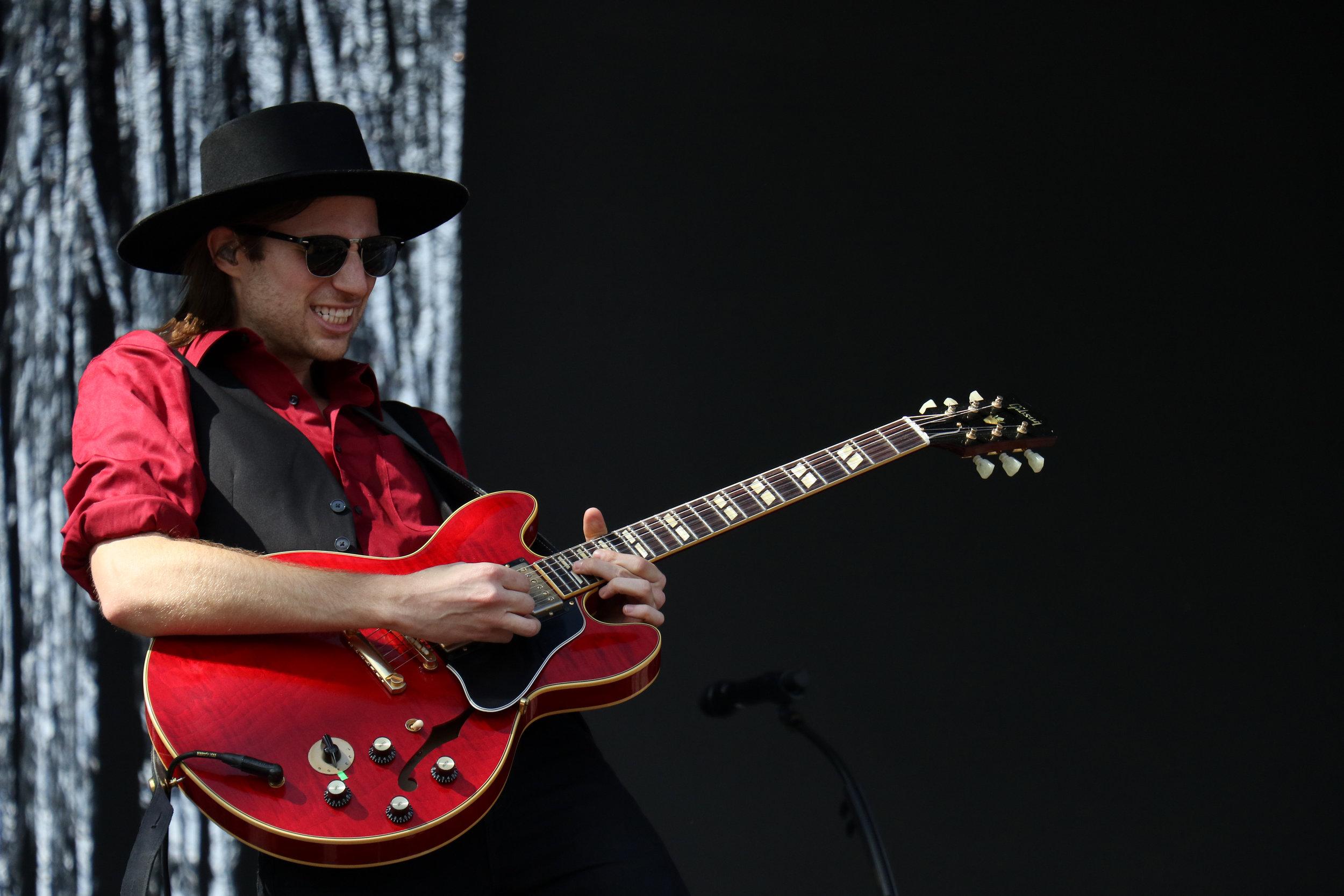   A/J Jackson, frontman of Saint Motel, takes a guitar solo.  