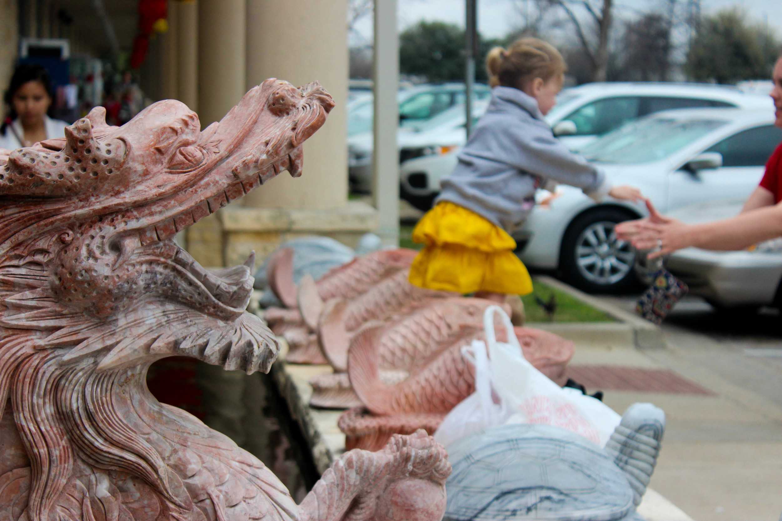  Chinese New Year adornments and children of all ages flood Chinatown Center. 