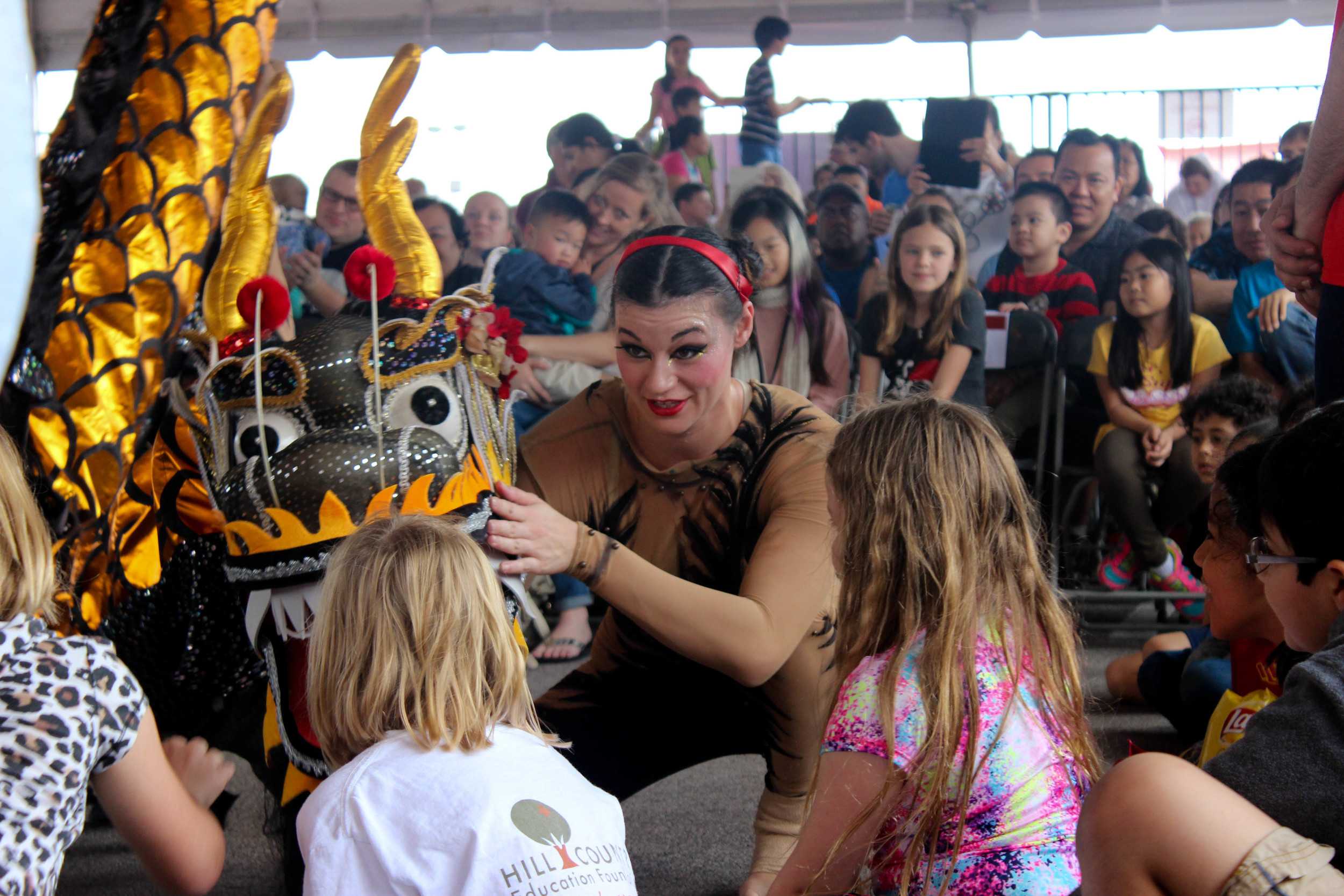  Some of the kids at the Chinese New Year celebration this year get a close-up experience. 