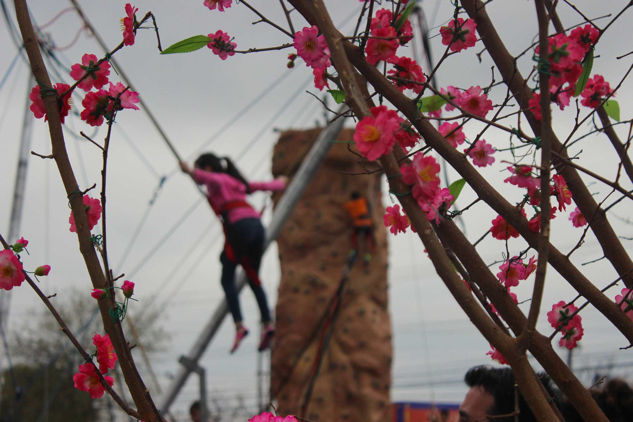  There are a multitude of attractions at the festival, including rock climbing and trampoline jumping with bungee cords. 