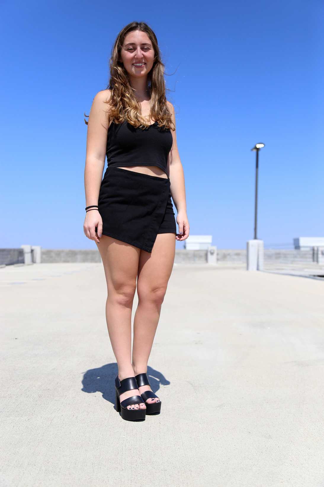  5-foot-1-inch computer science junior Jenna Goldberg dresses in a black two-piece ensemble.  Photograph by Betsy Joles  