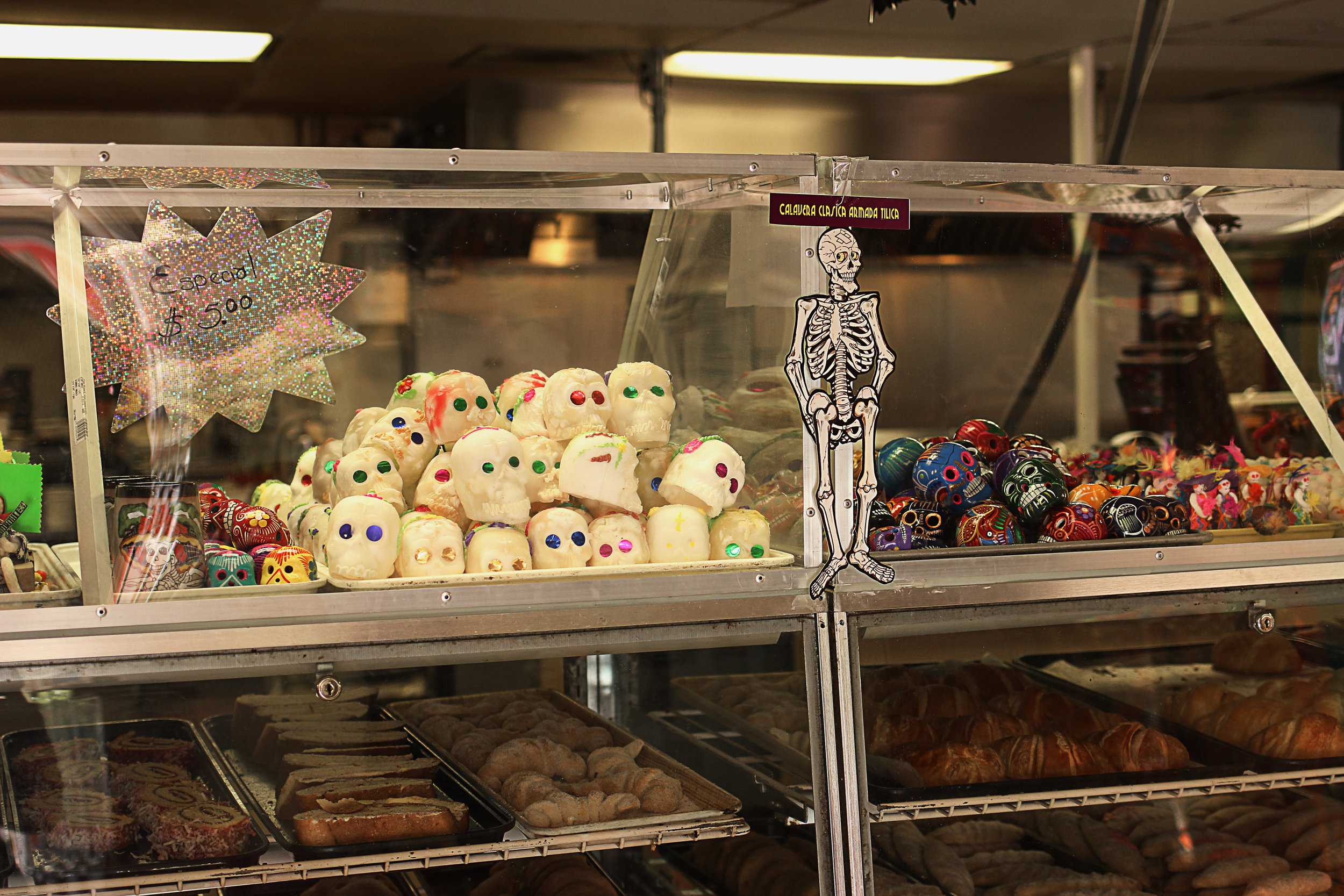   La Mexicana Bakery displays a variety of sweet treats and paraphernalia for Dia de Los Muertos.  