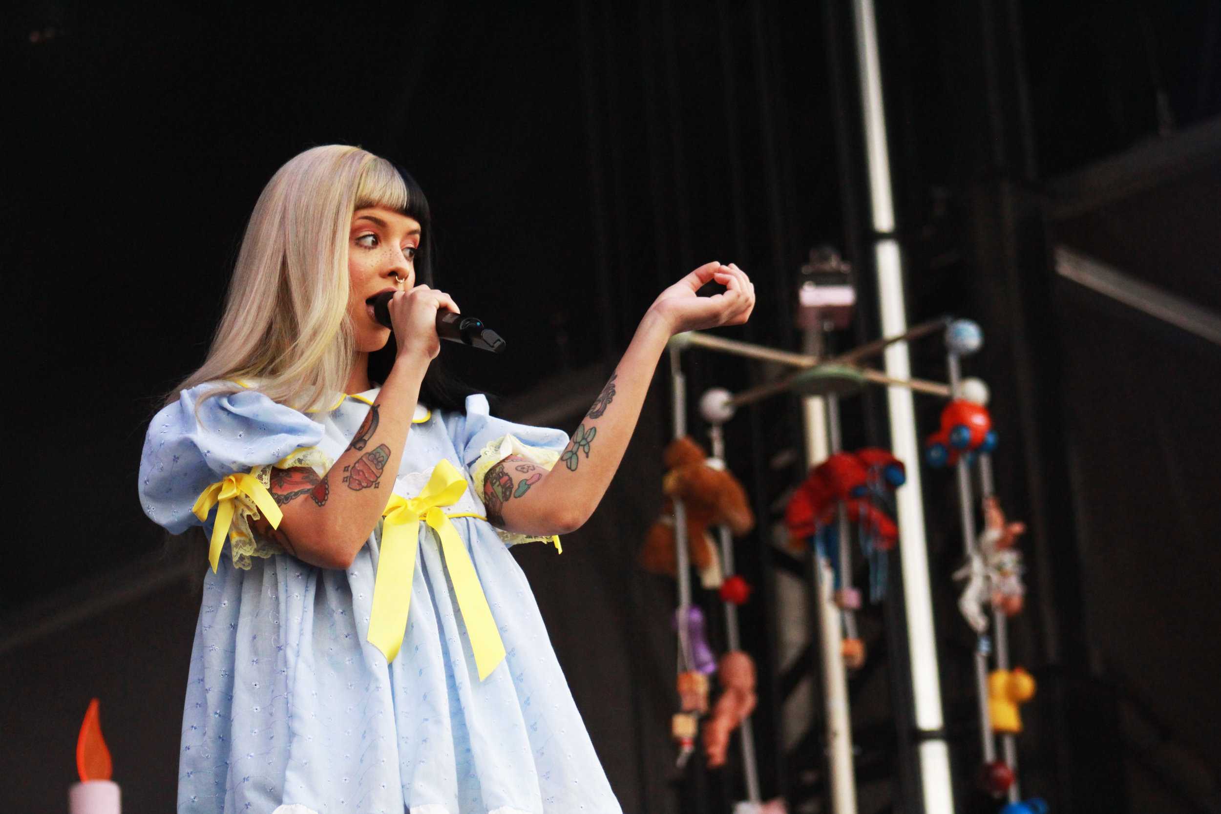   Melanie Martinez, a former competitor on The Voice, sings to the crowd.&nbsp;  