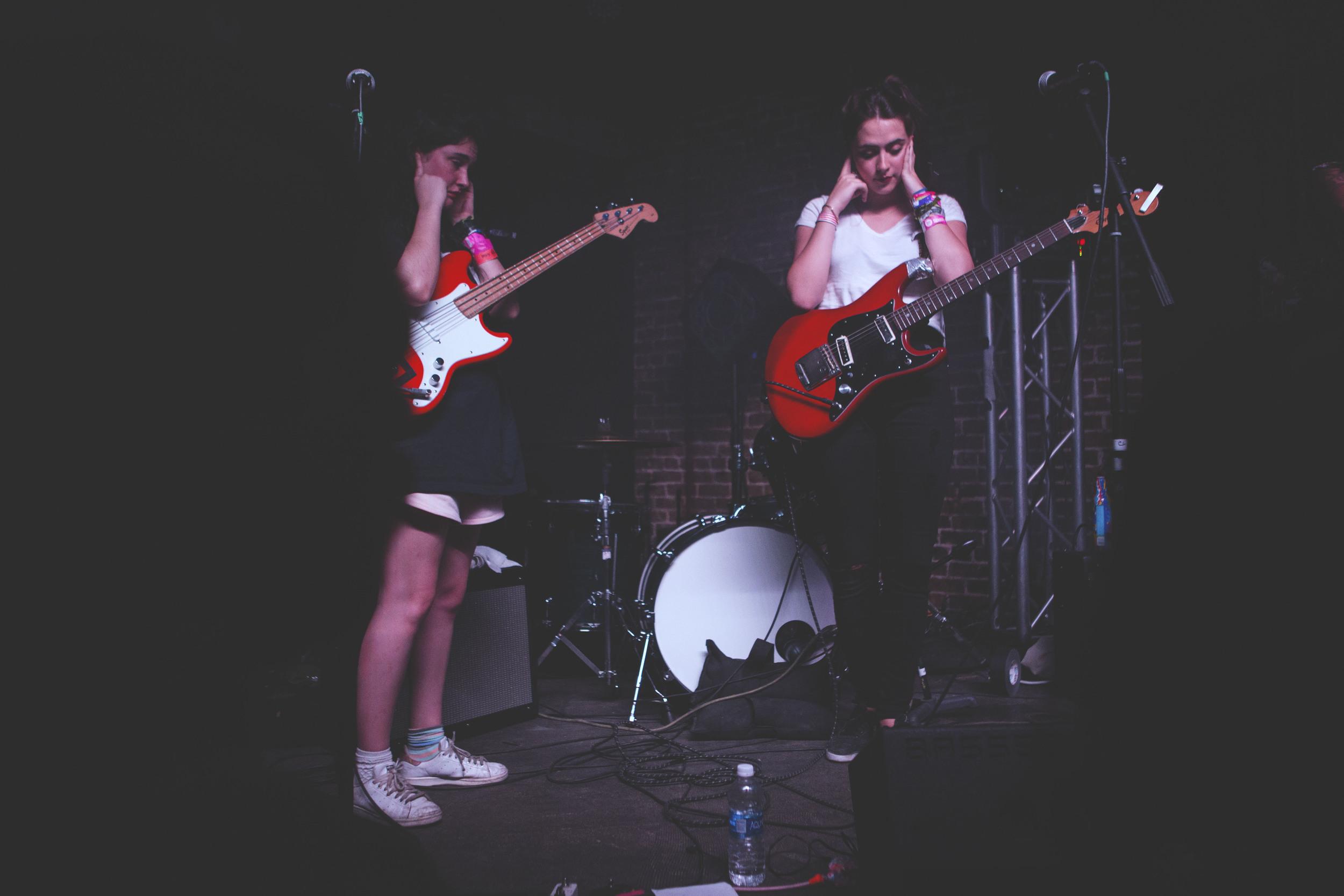  Hinds, a garage rock group from Spain, covers their ears during their soundcheck at the Main II on March 18. The soundcheck ran 30 minutes overtime and the group performed their set despite ongoing sound difficulties. 