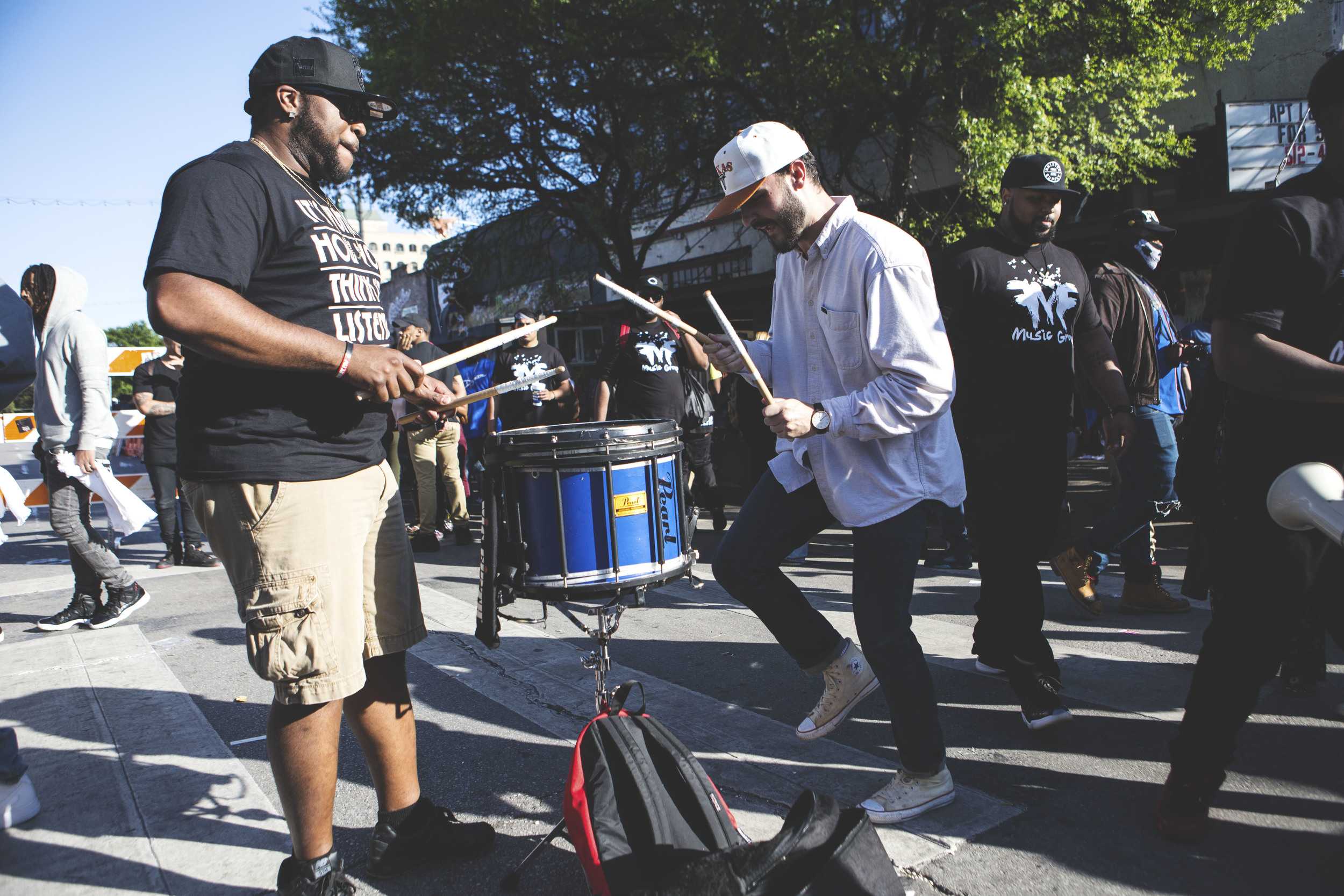  A street musician performs on Sixth Street on the last day of SXSW. 