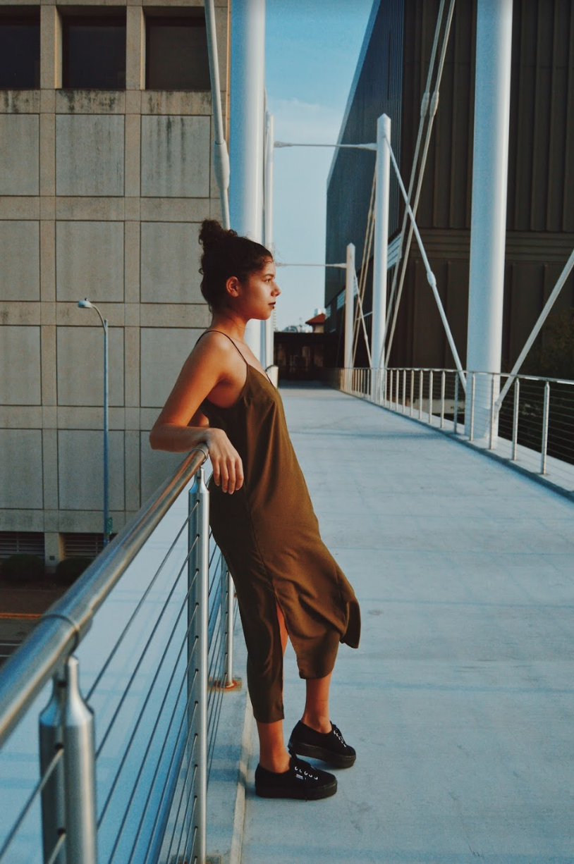    Perez wears an olive green slip dress by The Fifth Label. Shoes pictured are model’s own.    