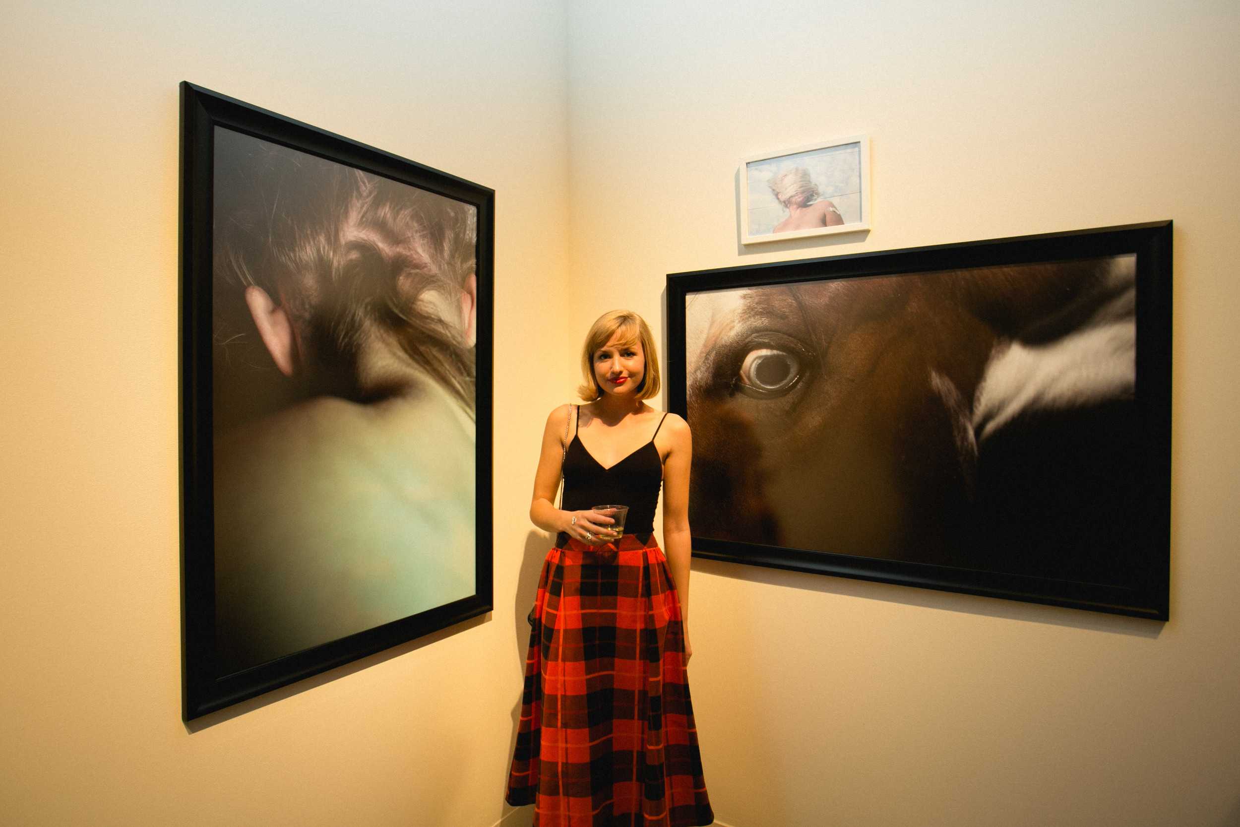   Chandler Allen, Studio Art Major with a focus in photography.    Her works are inspired by the animalistic nature of humans, vulnerability, sexuality, female form and identity.    She is pictured with Withers (2015), Ghost (2015), and Sundance (201