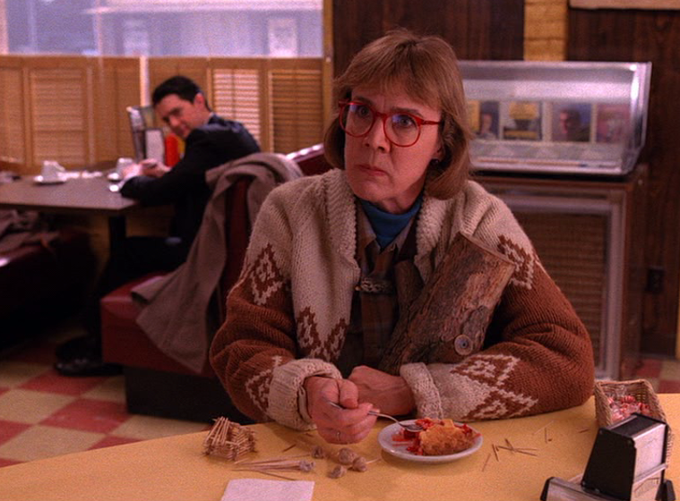   THE LOG LADY    What horrors has the Log Lady seen? Whatever secret she’s hiding, it’s obvious that it could put someone important behind bars. The Log Lady often wears cardigans and sweaters with intricate patterns, perhaps reflecting her hidden, 