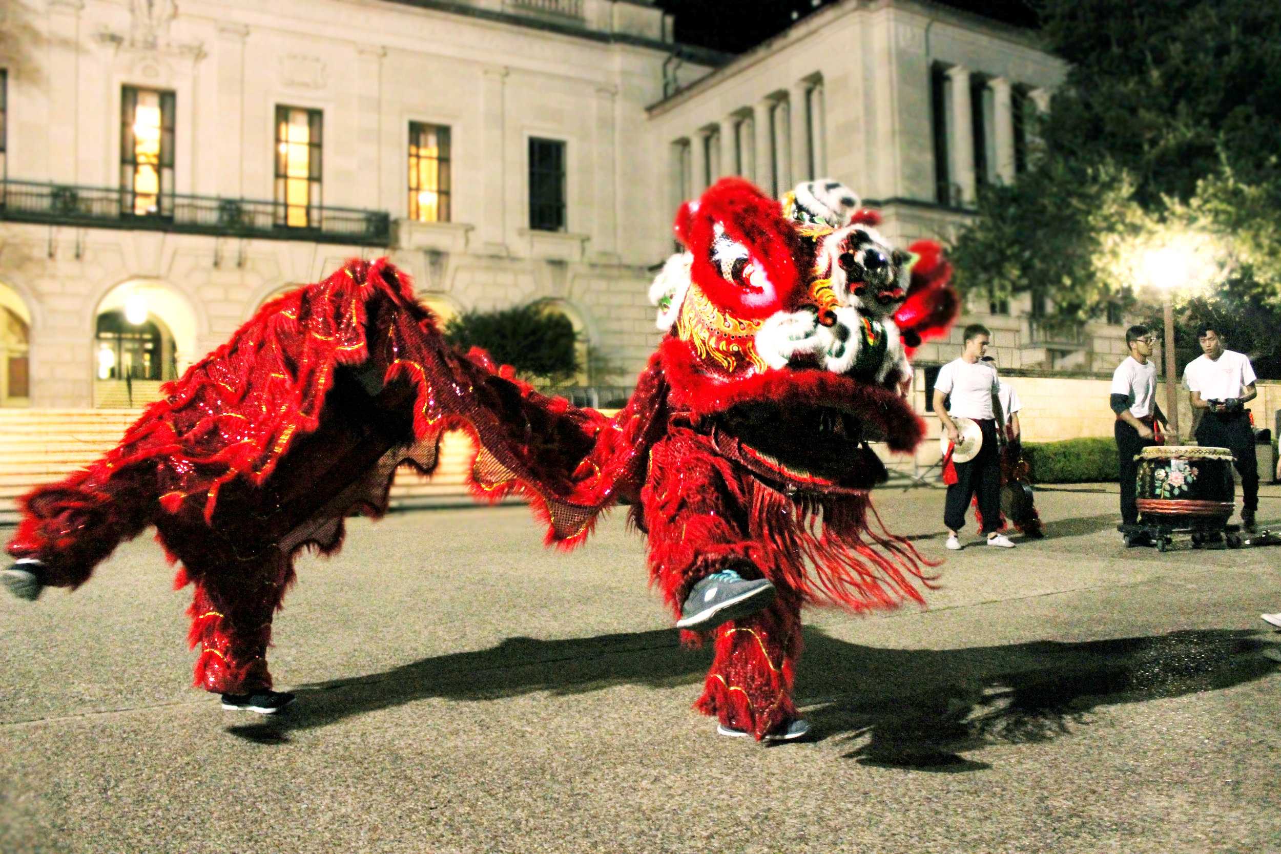   The Texas Dragon Dance Team performs in front of the tower.  