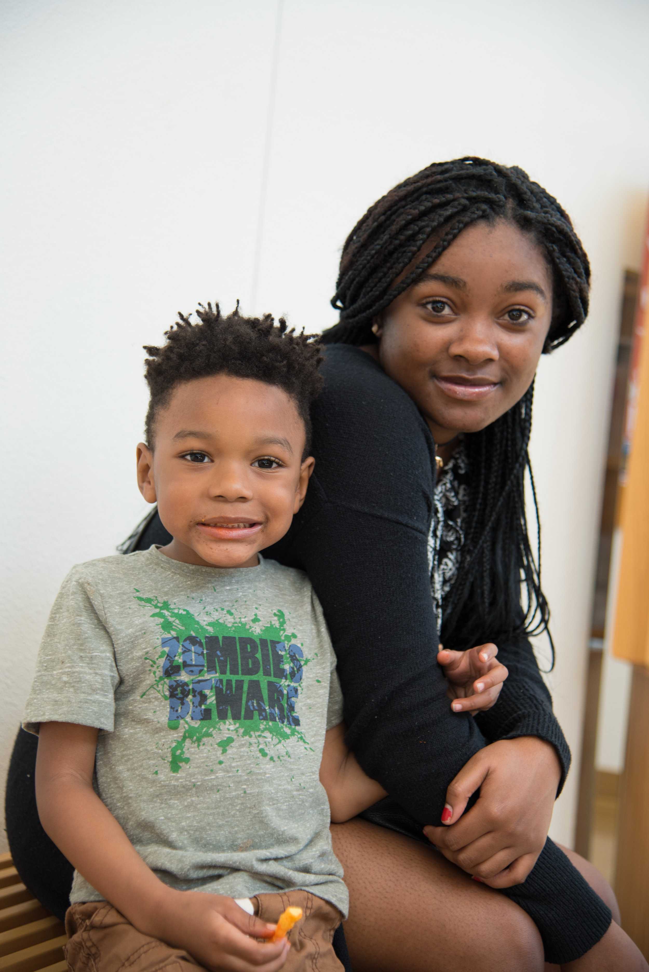  “[I’m excited about] telling my teacher I learned about black history” says Micah, age four, with a little help from his mom. 