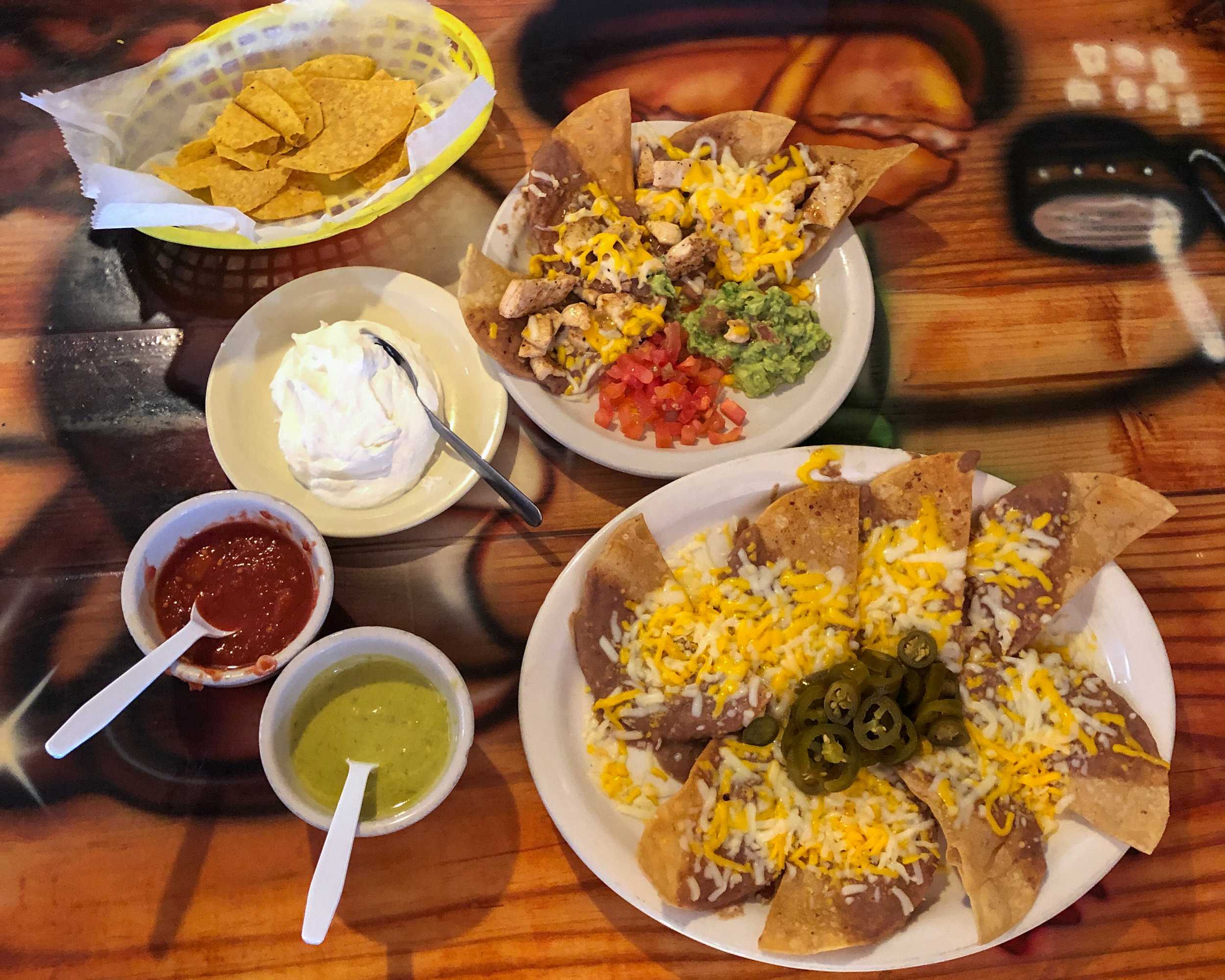   Two nacho appetizers with chips, salsa and guacamole from El Secreto de La Abuela  