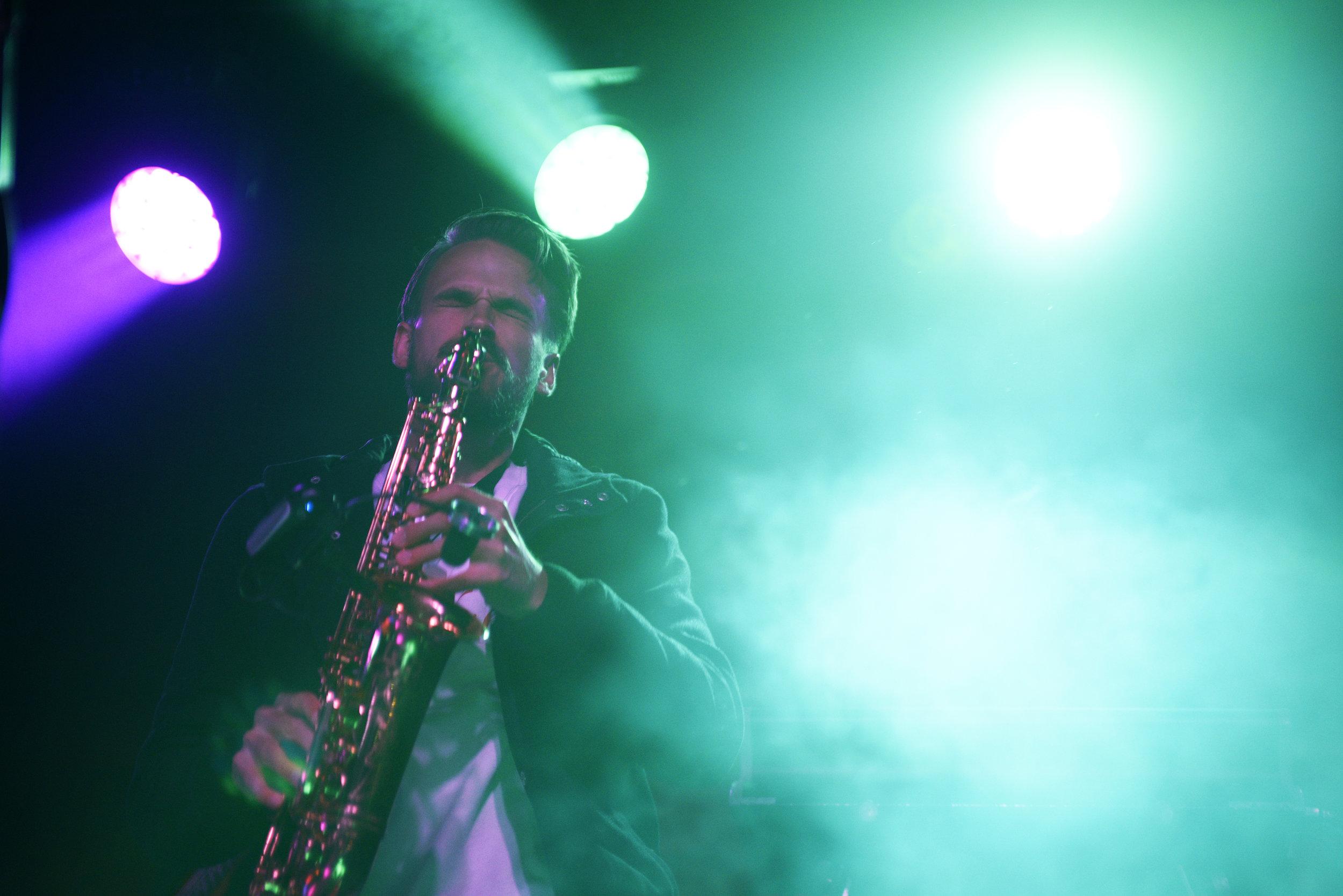   Albert Allenback plays the saxophone during the second song of the set.  